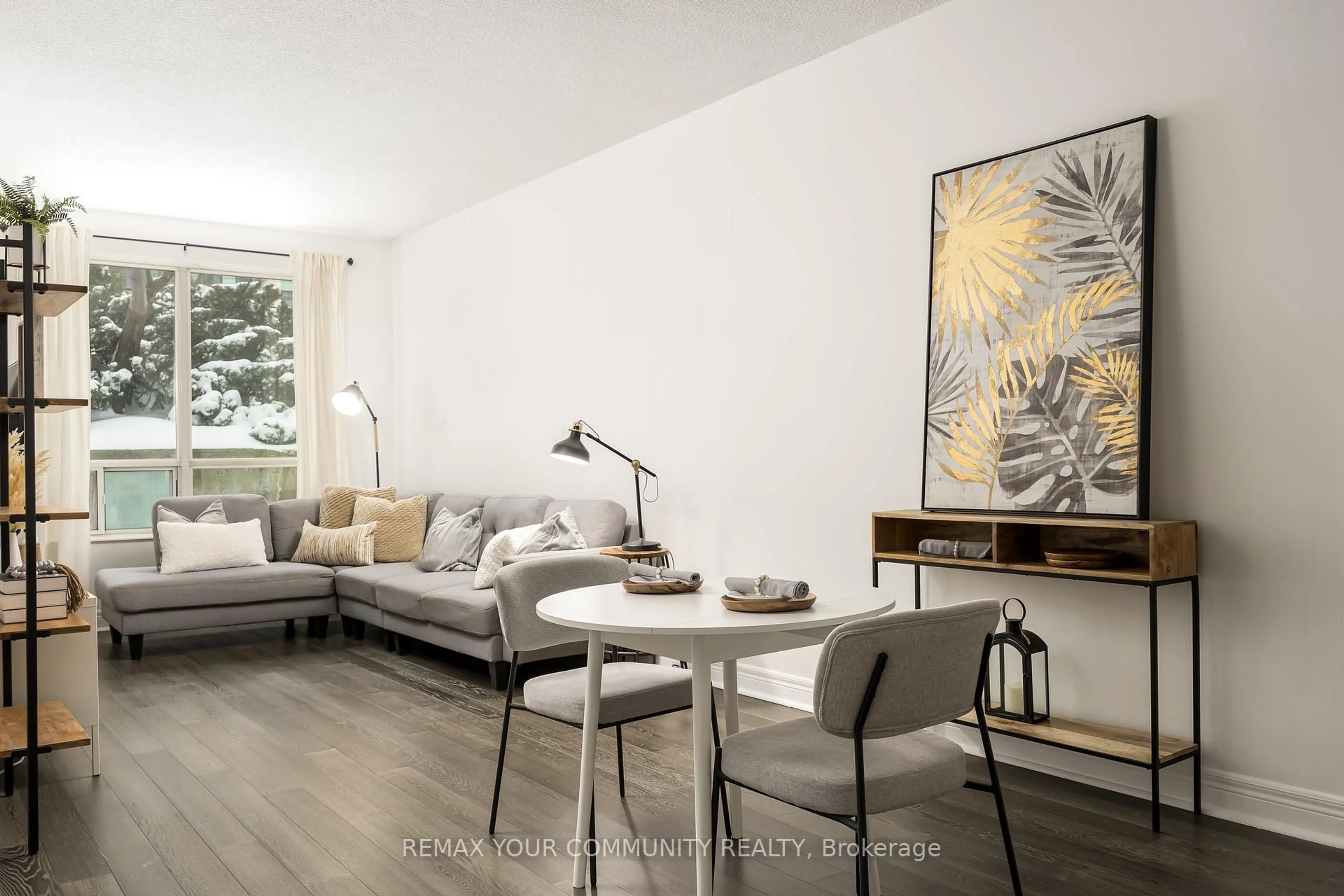 Living room with furniture, wood/laminate floor for 48 Suncrest Blvd #111, Markham Ontario L3T 7Y6