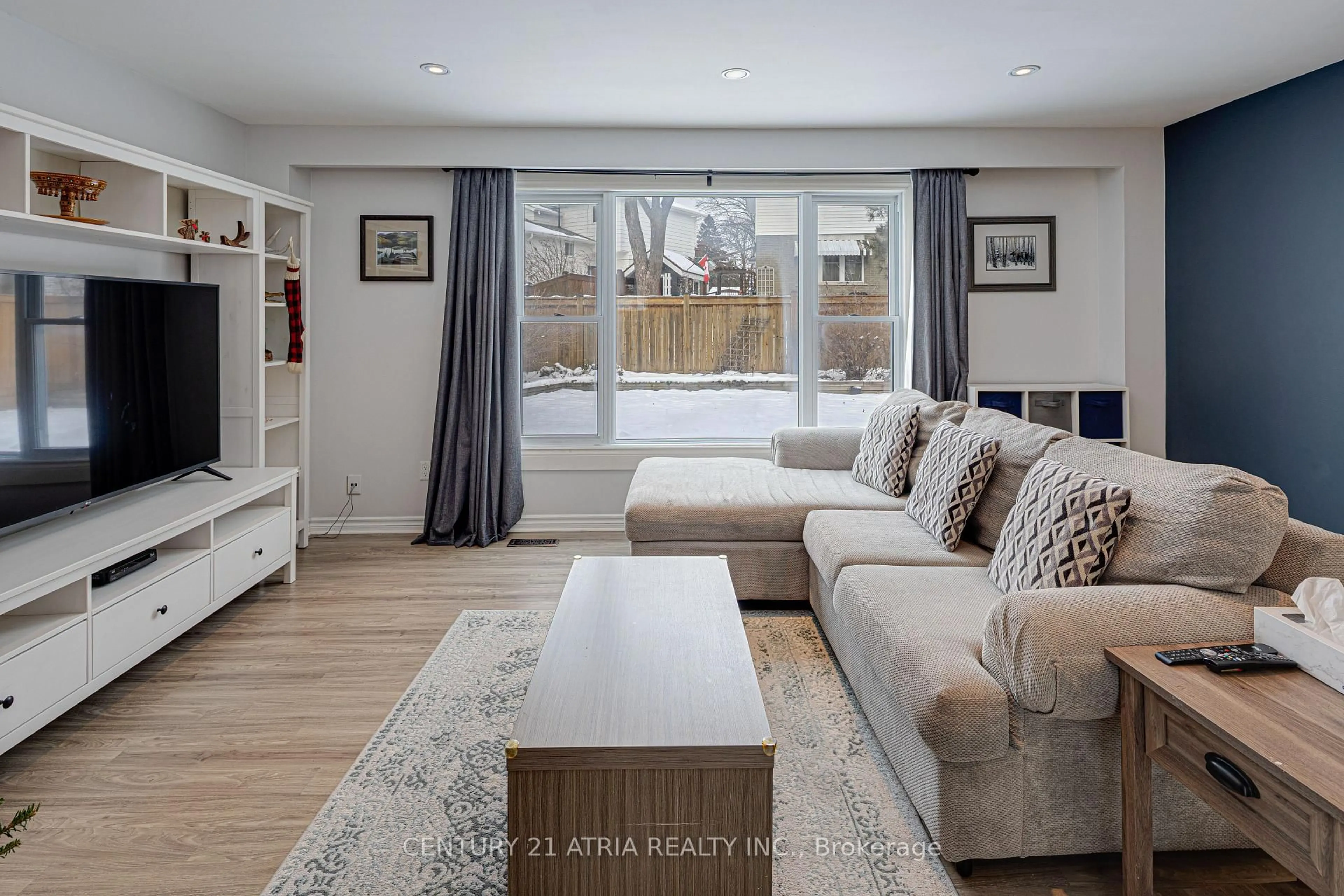 Living room with furniture, wood/laminate floor for 251 Stouffer St, Whitchurch-Stouffville Ontario L4A 4Y8