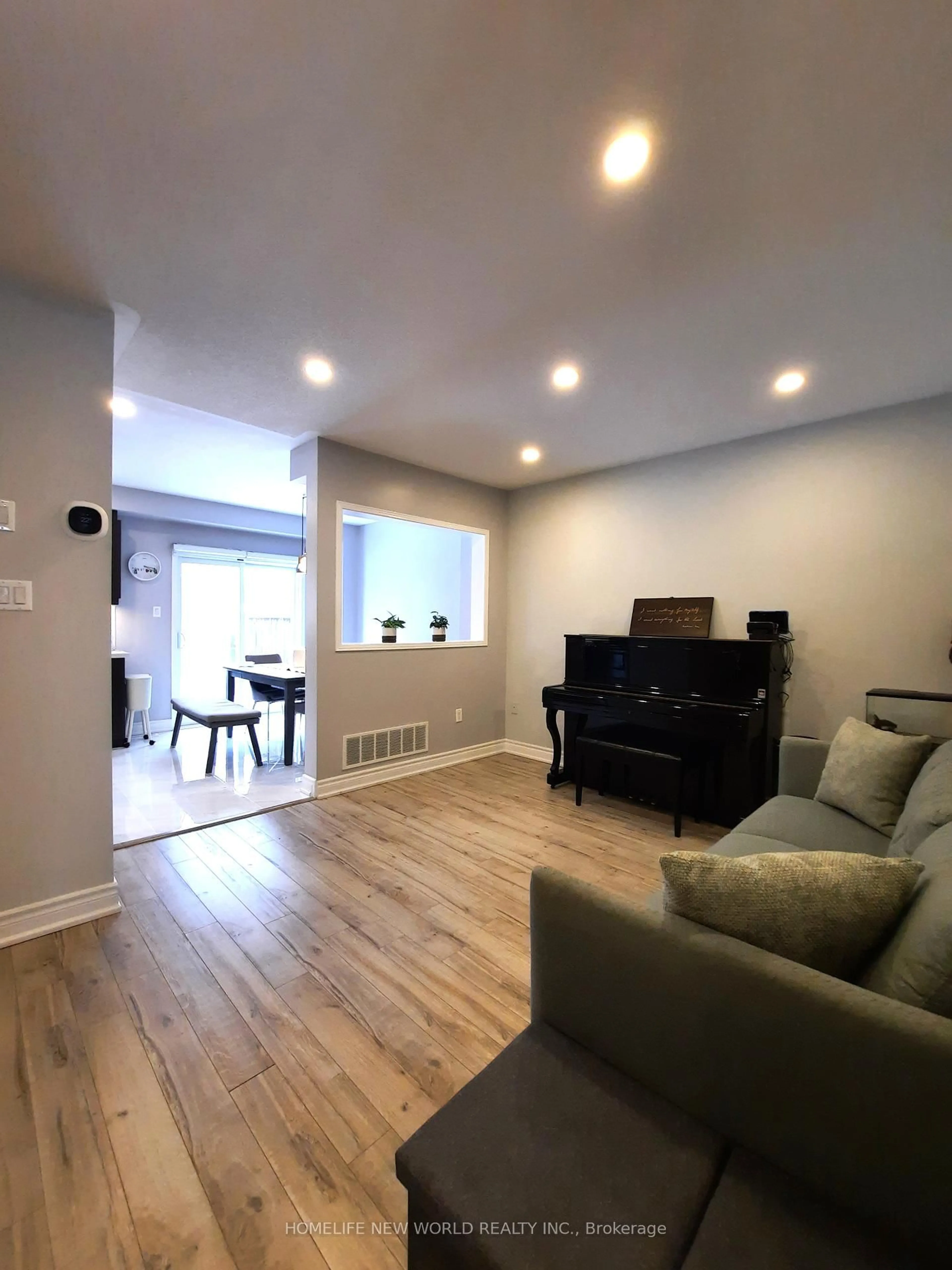 Living room with furniture, wood/laminate floor for 43 All Points Dr, Whitchurch-Stouffville Ontario L4A 0W5