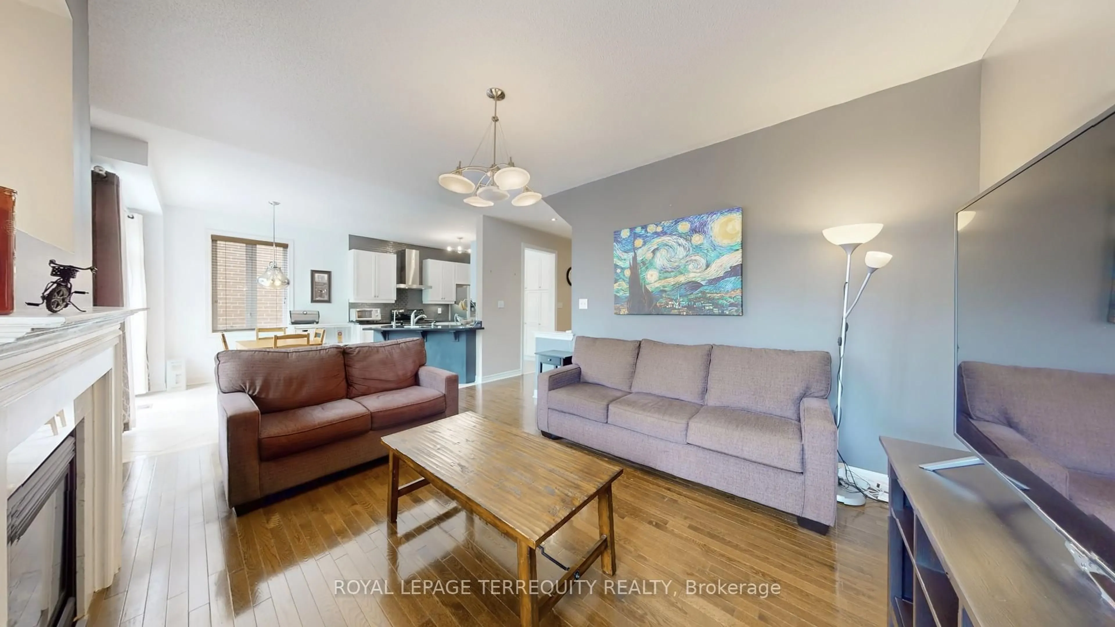 Living room with furniture, wood/laminate floor for 69 Vine Cliff Blvd, Markham Ontario L6C 3E2