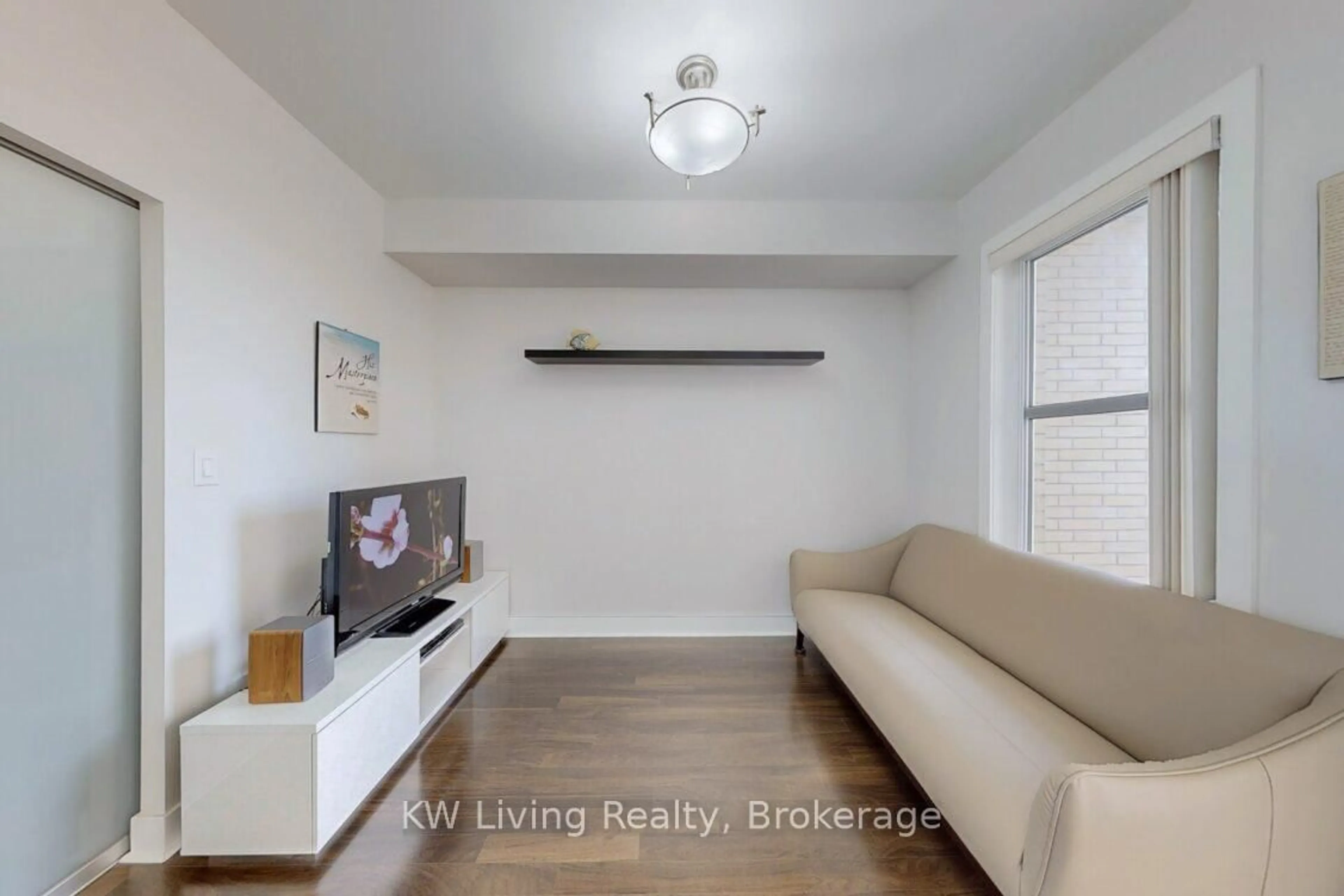 Living room with furniture, wood/laminate floor for 28 Prince Regent St #203, Markham Ontario L6C 0V5