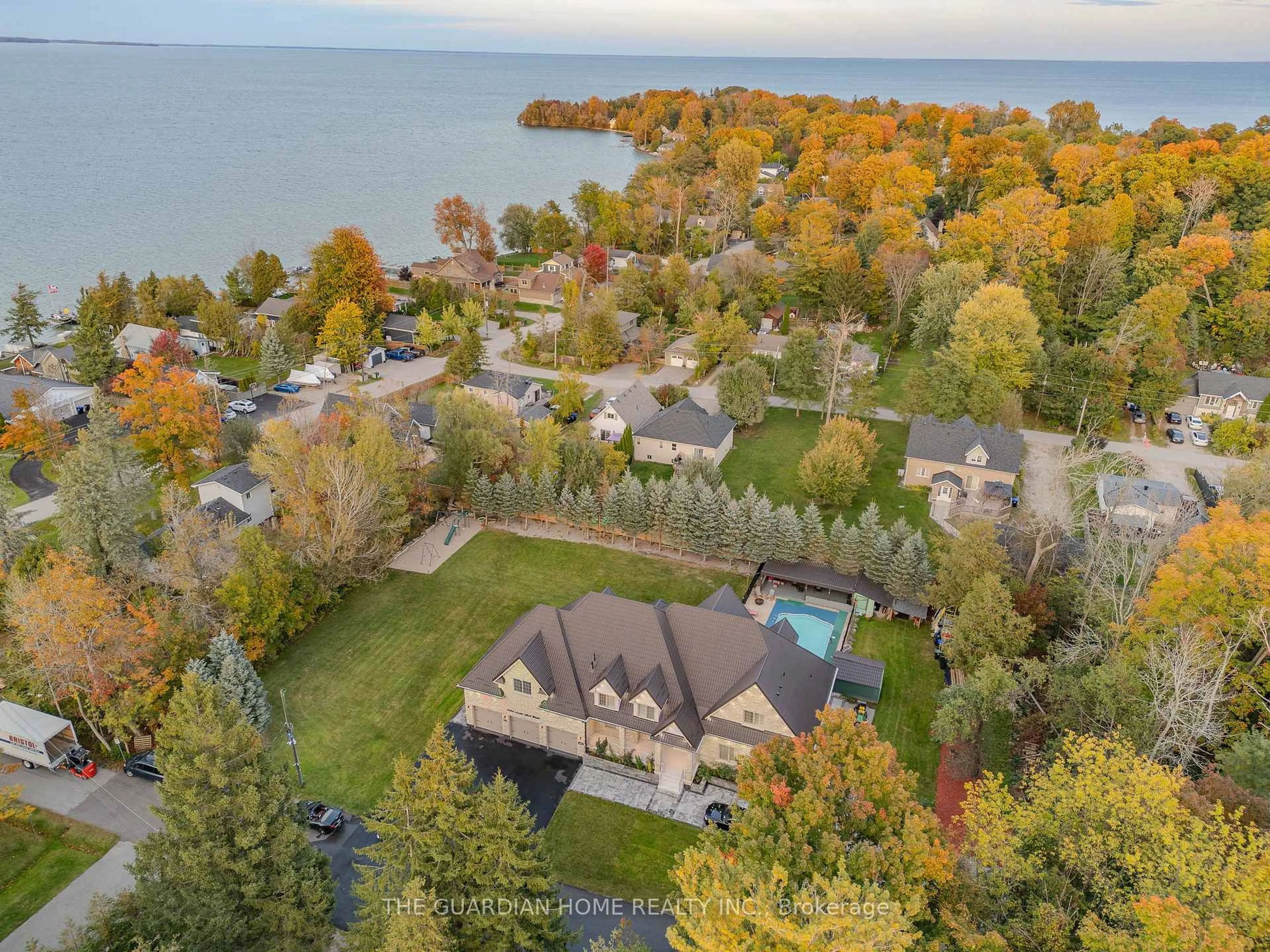 A pic from outside/outdoor area/front of a property/back of a property/a pic from drone, water/lake/river/ocean view for 3965 Algoma Ave, Innisfil Ontario L9S 2M1