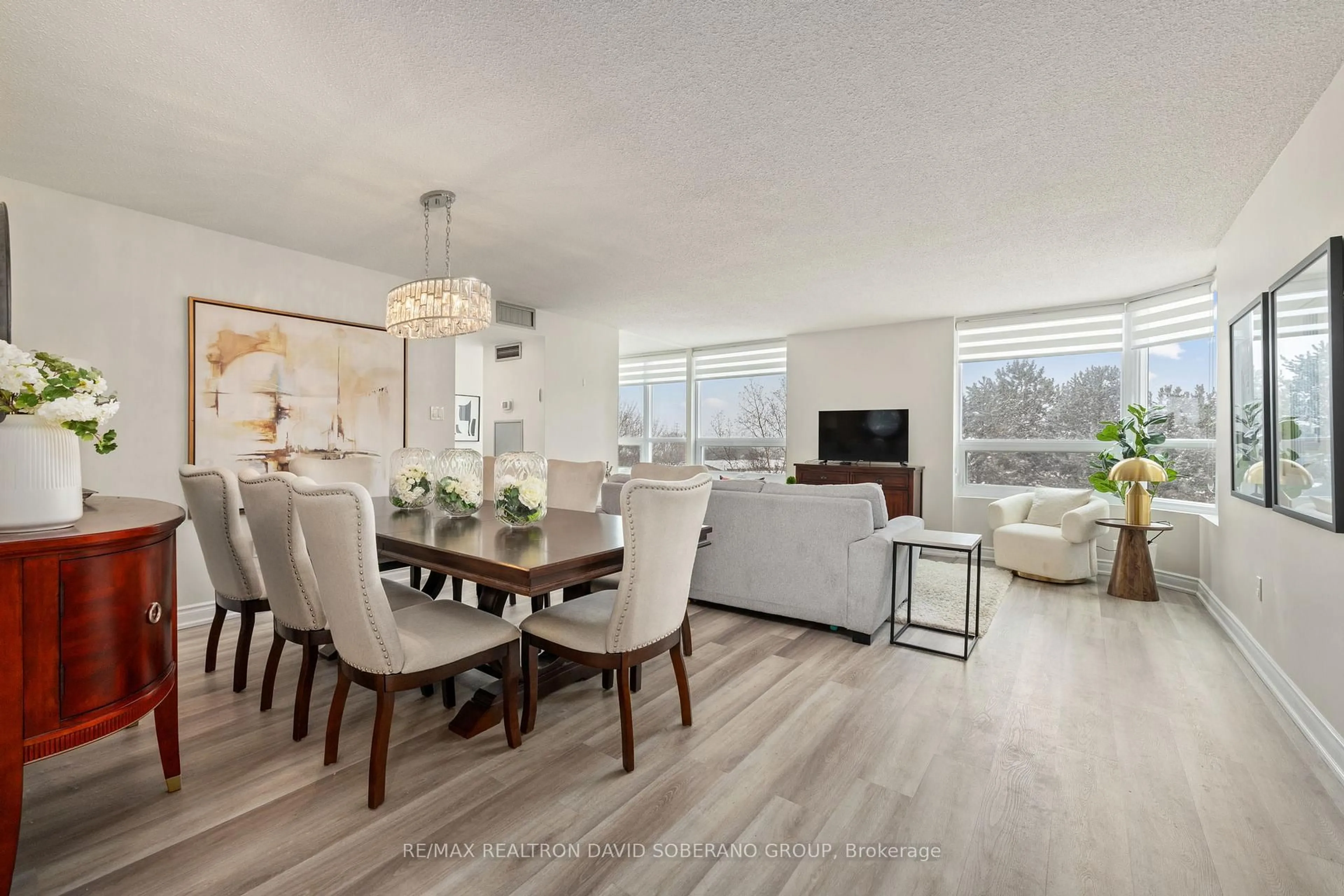 Living room with furniture, wood/laminate floor for 7601 Bathurst St #315, Vaughan Ontario L4J 4H5