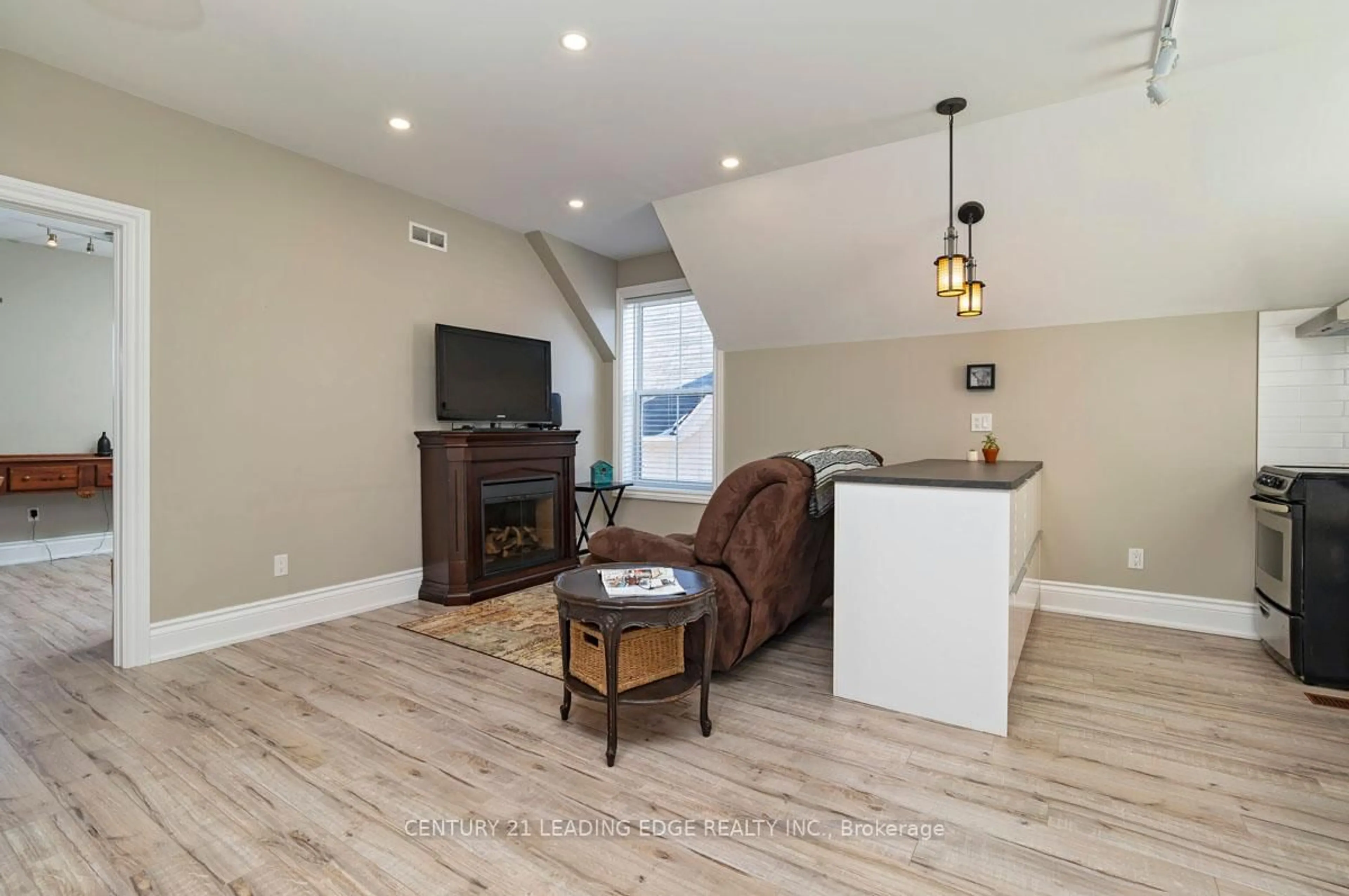 Living room with furniture, wood/laminate floor for 6391 Main St, Whitchurch-Stouffville Ontario L4A 1G4