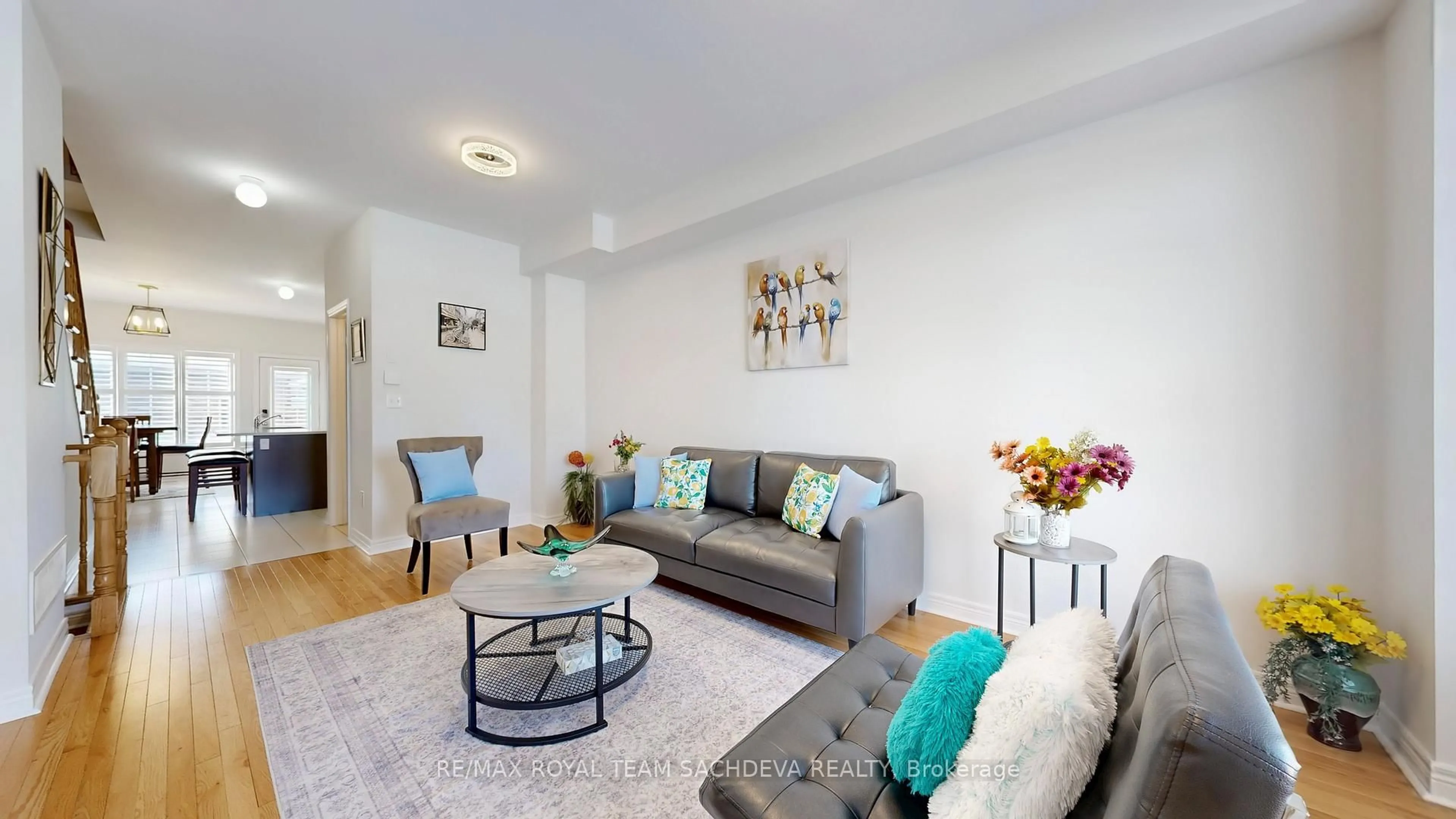 Living room with furniture, wood/laminate floor for 2006 Donald Cousens Pkwy, Markham Ontario L6B 1J5