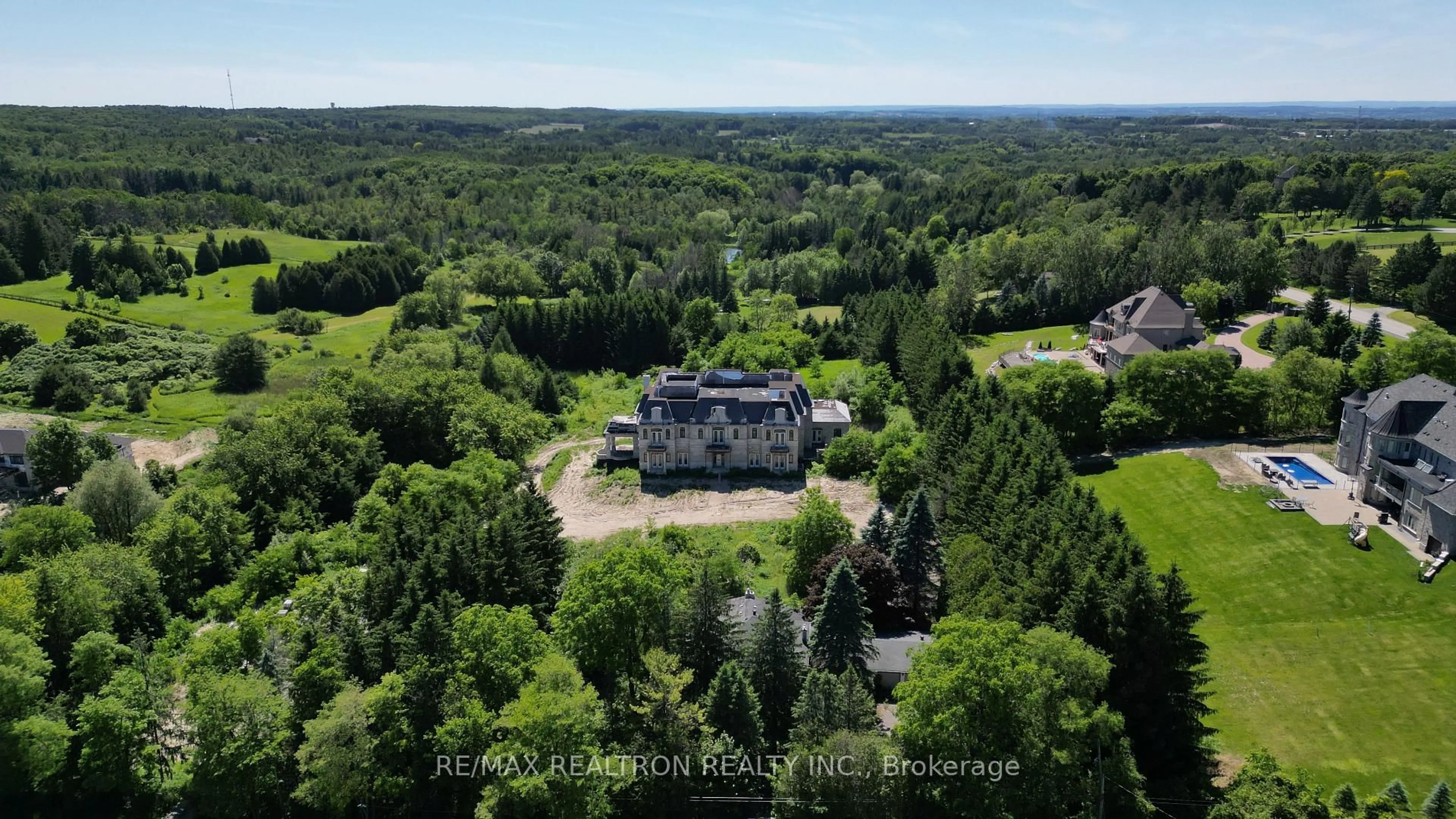 A pic from outside/outdoor area/front of a property/back of a property/a pic from drone, forest/trees view for 15230 Keele St, King Ontario L7B 1A3