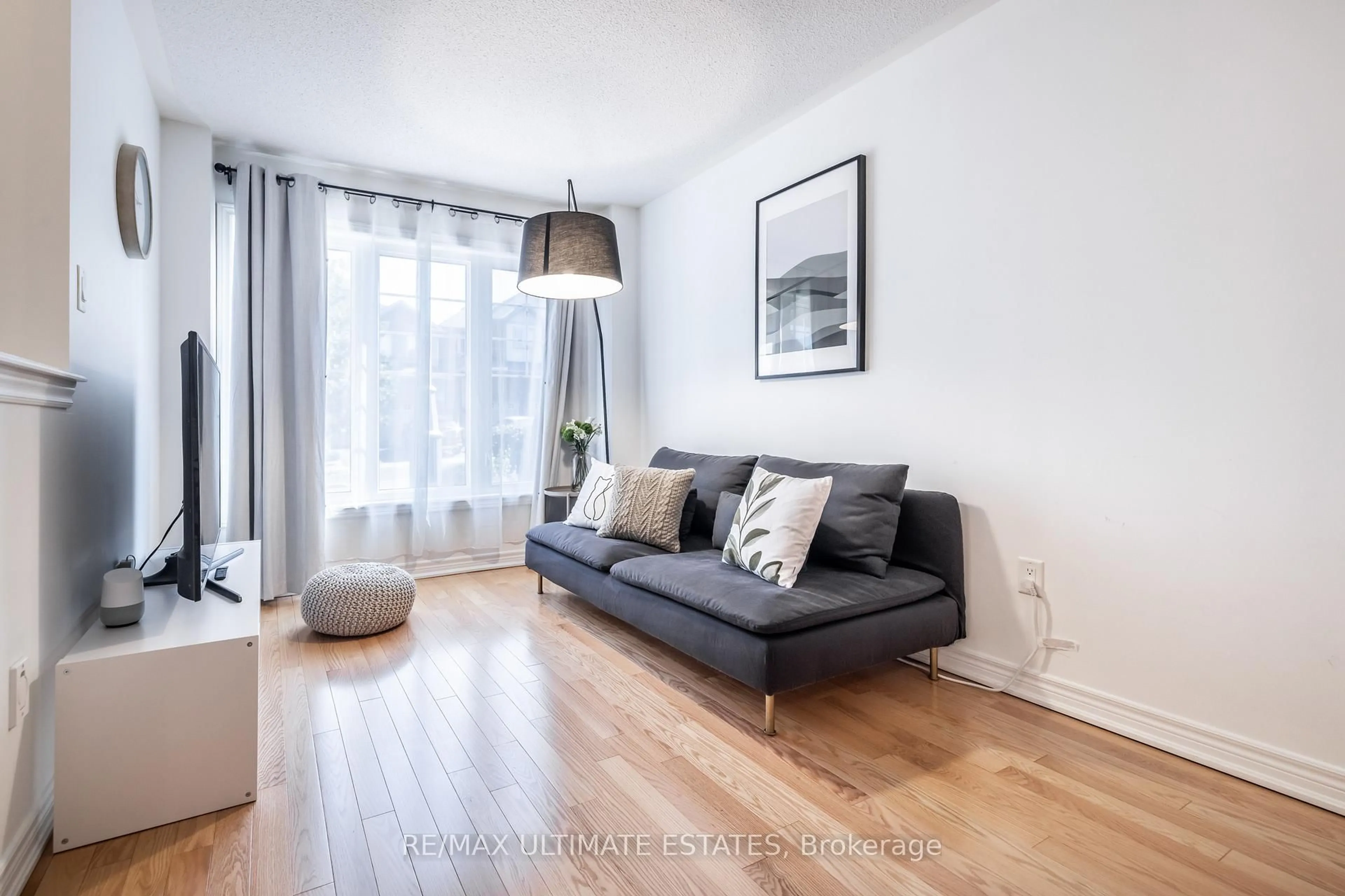 Living room with furniture, wood/laminate floor for 24 Yang St, Richmond Hill Ontario L4E 0L5