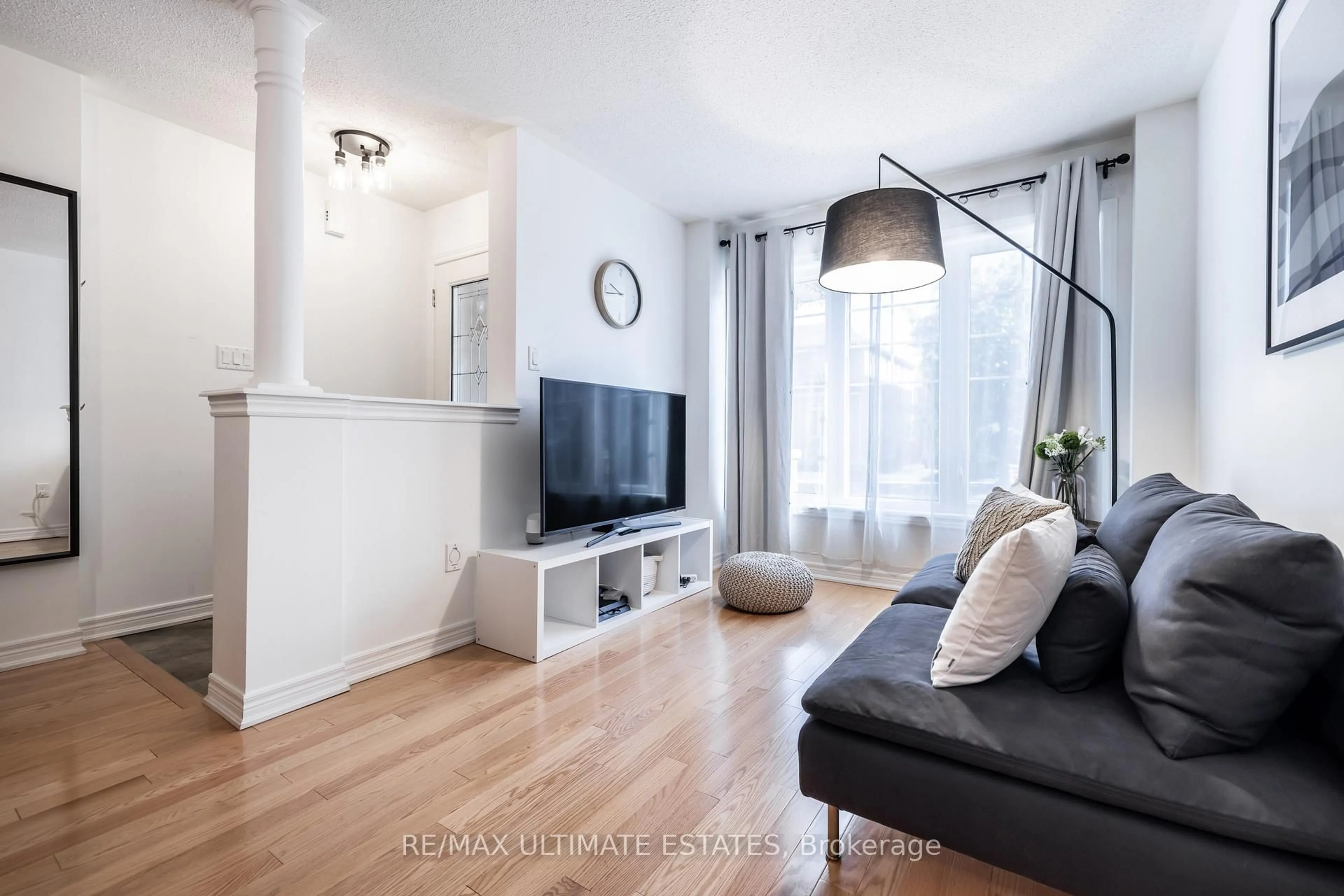 Living room with furniture, wood/laminate floor for 24 Yang St, Richmond Hill Ontario L4E 0L5
