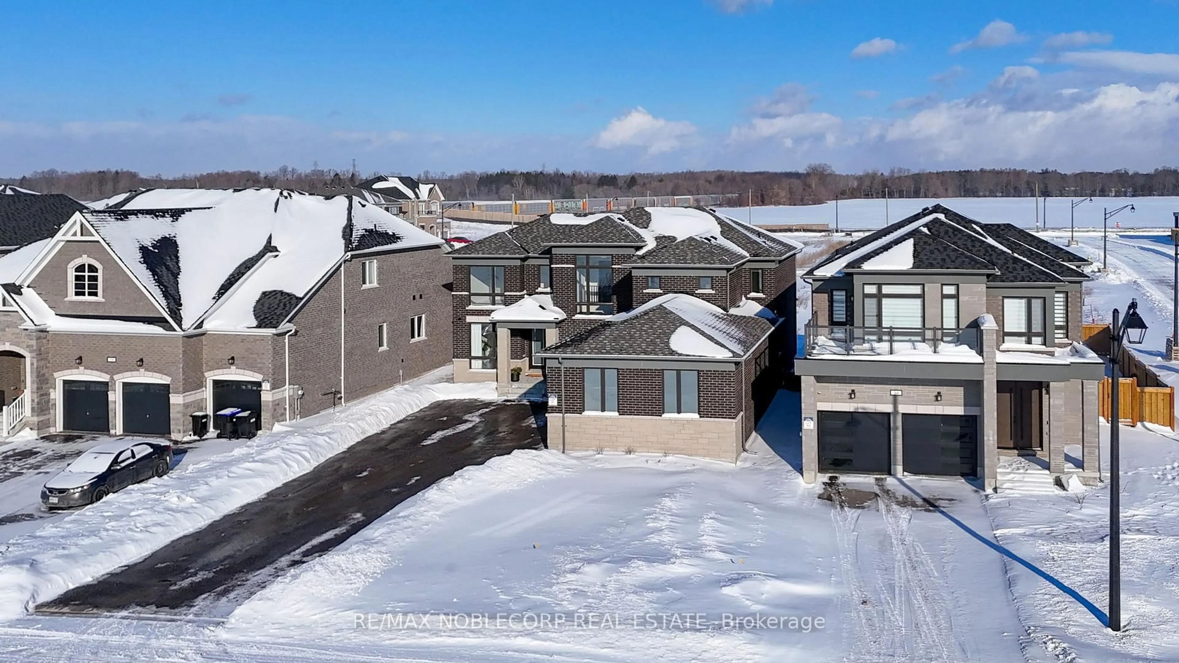 A pic from outside/outdoor area/front of a property/back of a property/a pic from drone, street for 36 Felhazi Tr, Essa Ontario L3W 0A4