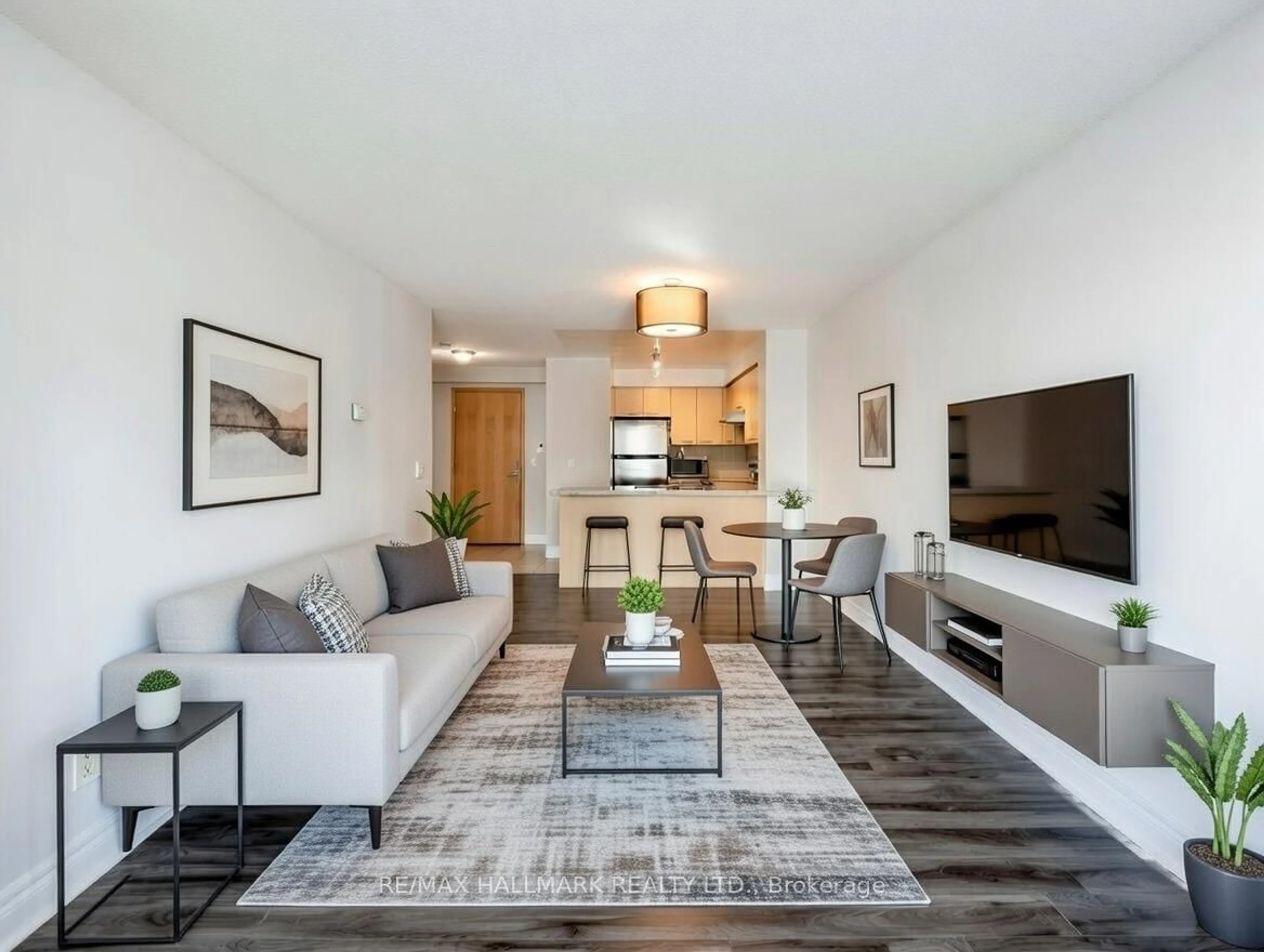 Living room with furniture, wood/laminate floor for 48 Suncrest Blvd #616, Markham Ontario L3T 7Y5