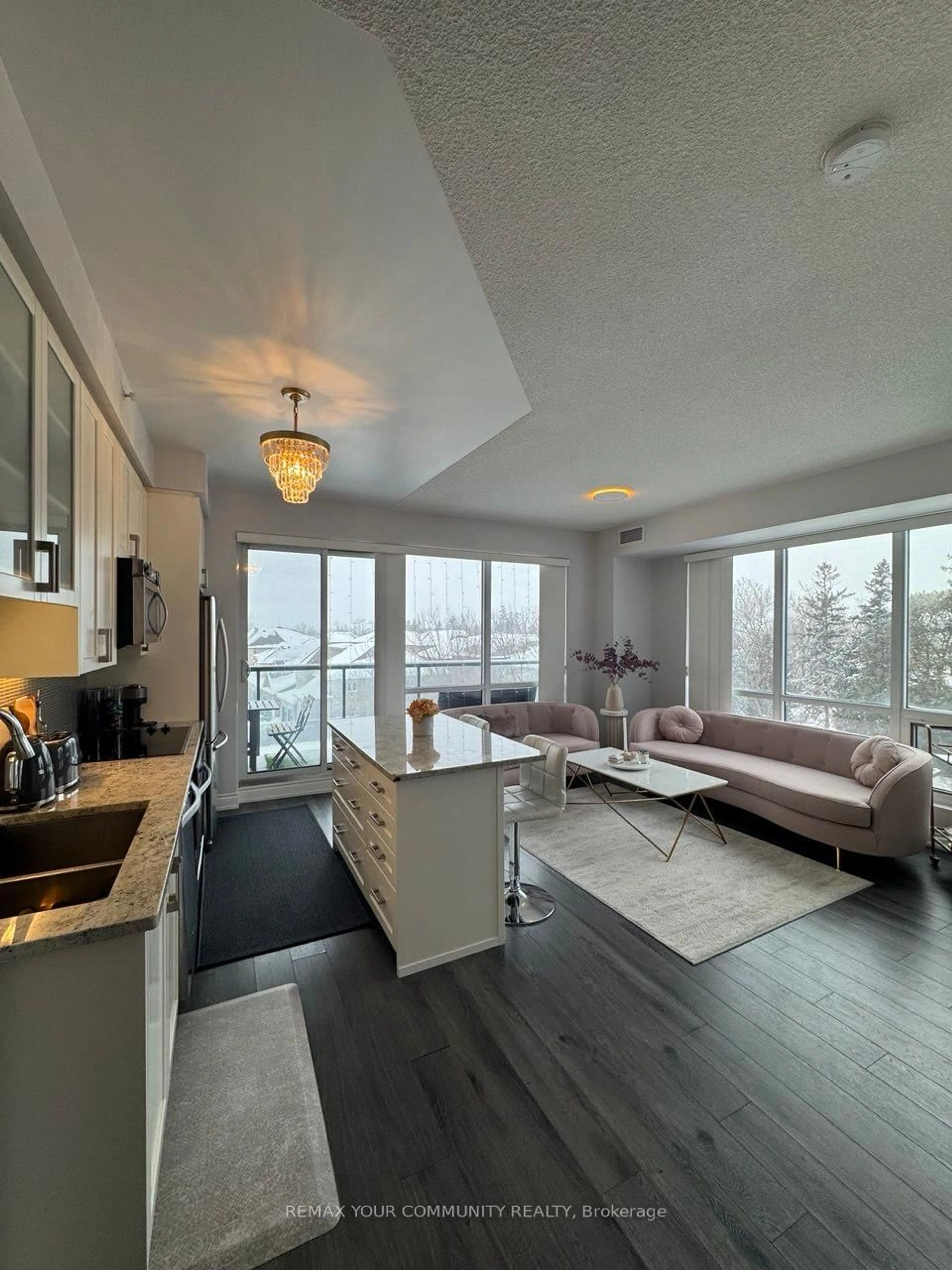 Living room with furniture, wood/laminate floor for 9090 Yonge St #302B, Richmond Hill Ontario L4C 0Z1