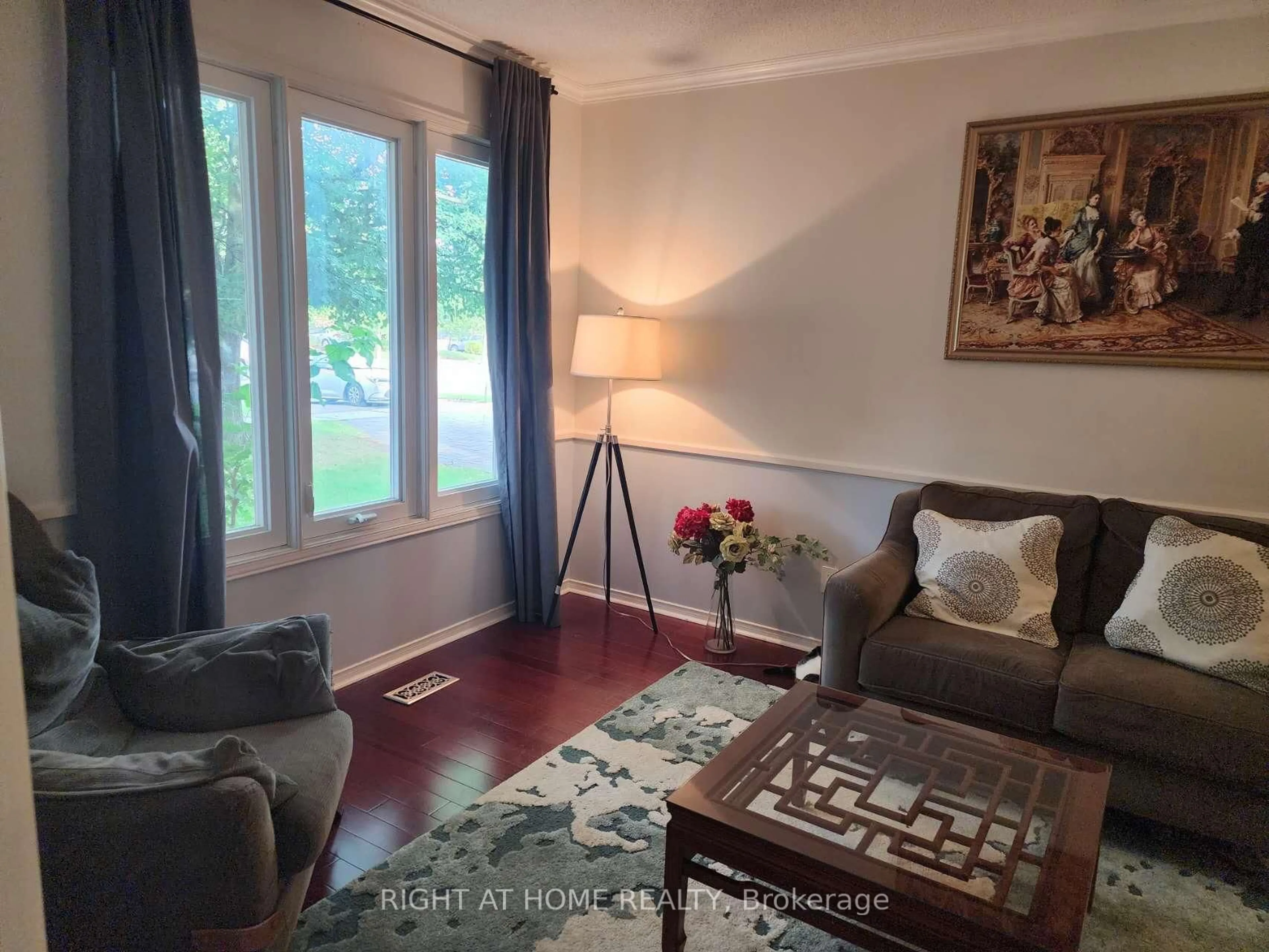 Living room with furniture, wood/laminate floor for 3 Hollingham Rd, Markham Ontario L3R 7Y1