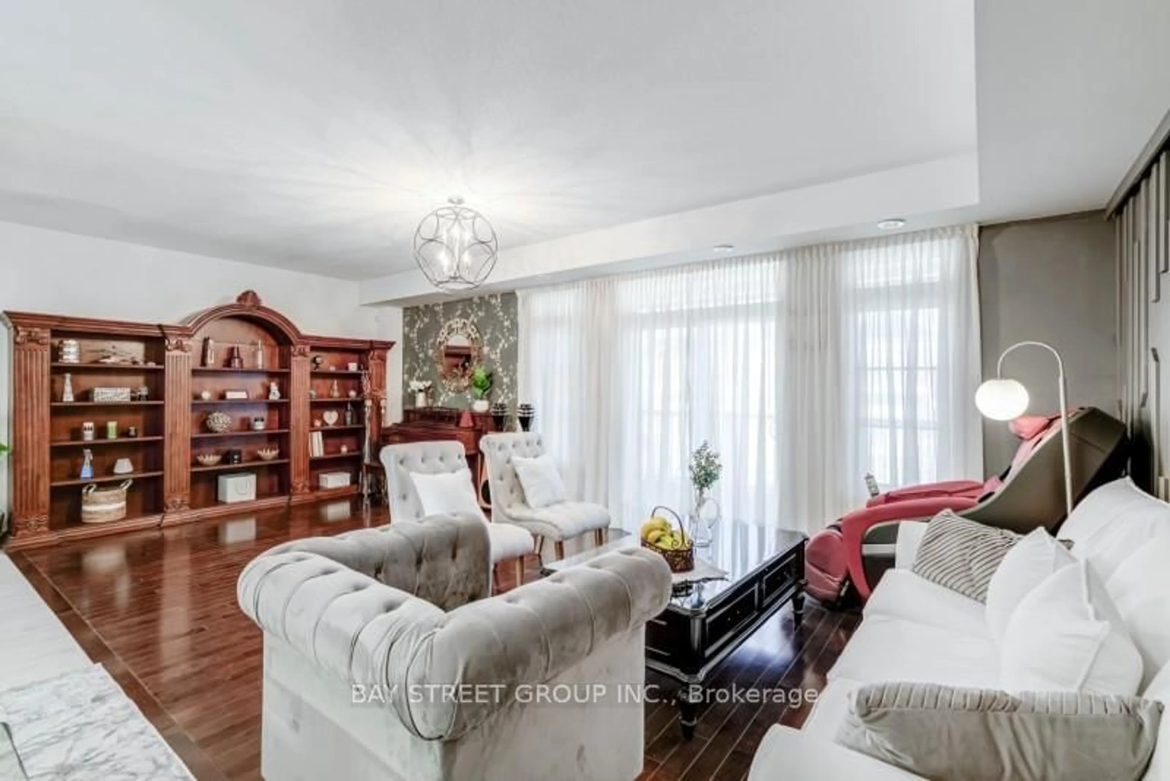 Living room with furniture, wood/laminate floor for 121 Luzon Ave, Markham Ontario L6B 1N8