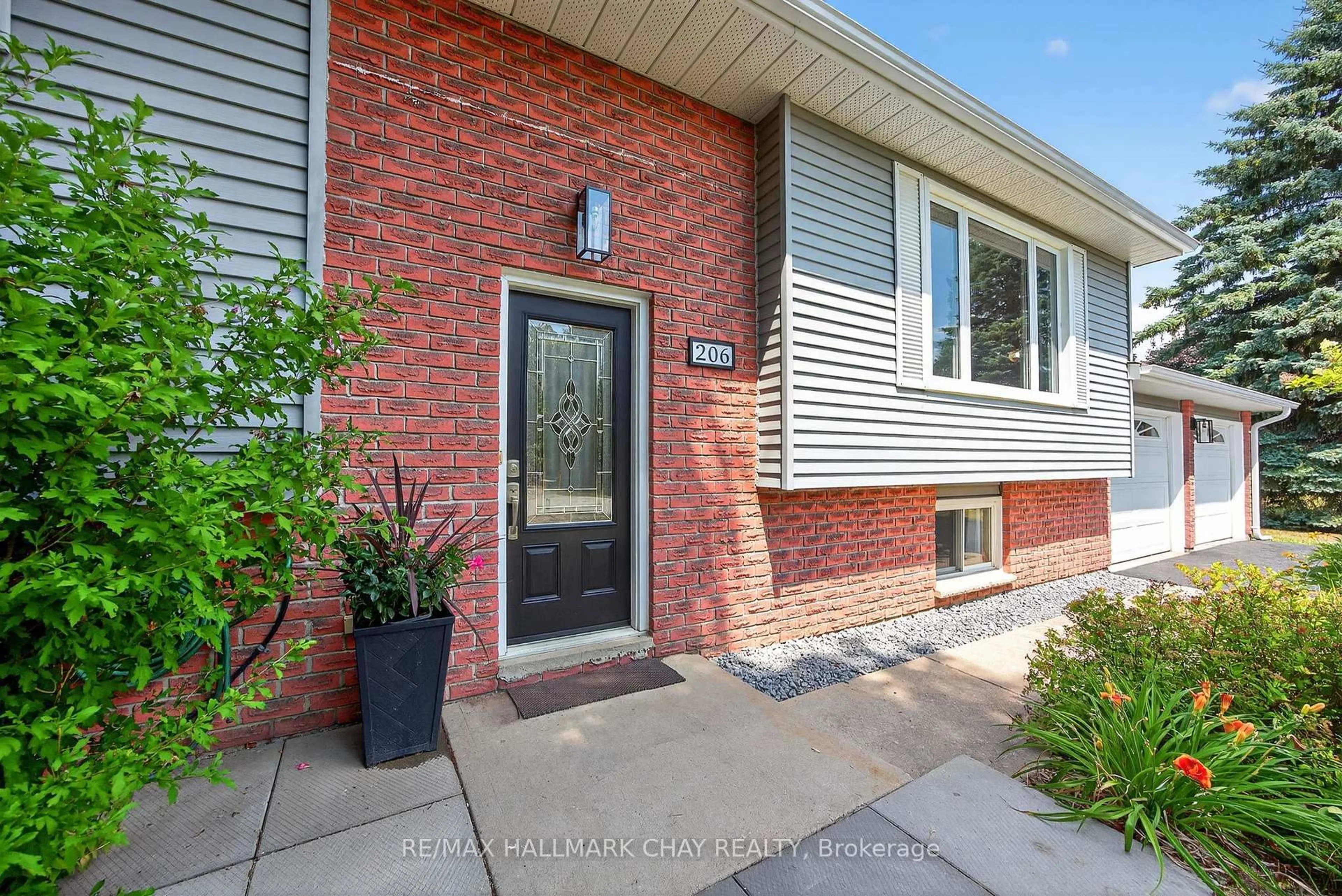 Home with brick exterior material, street for 206 North Ridge Rd, Essa Ontario L0L 2N0