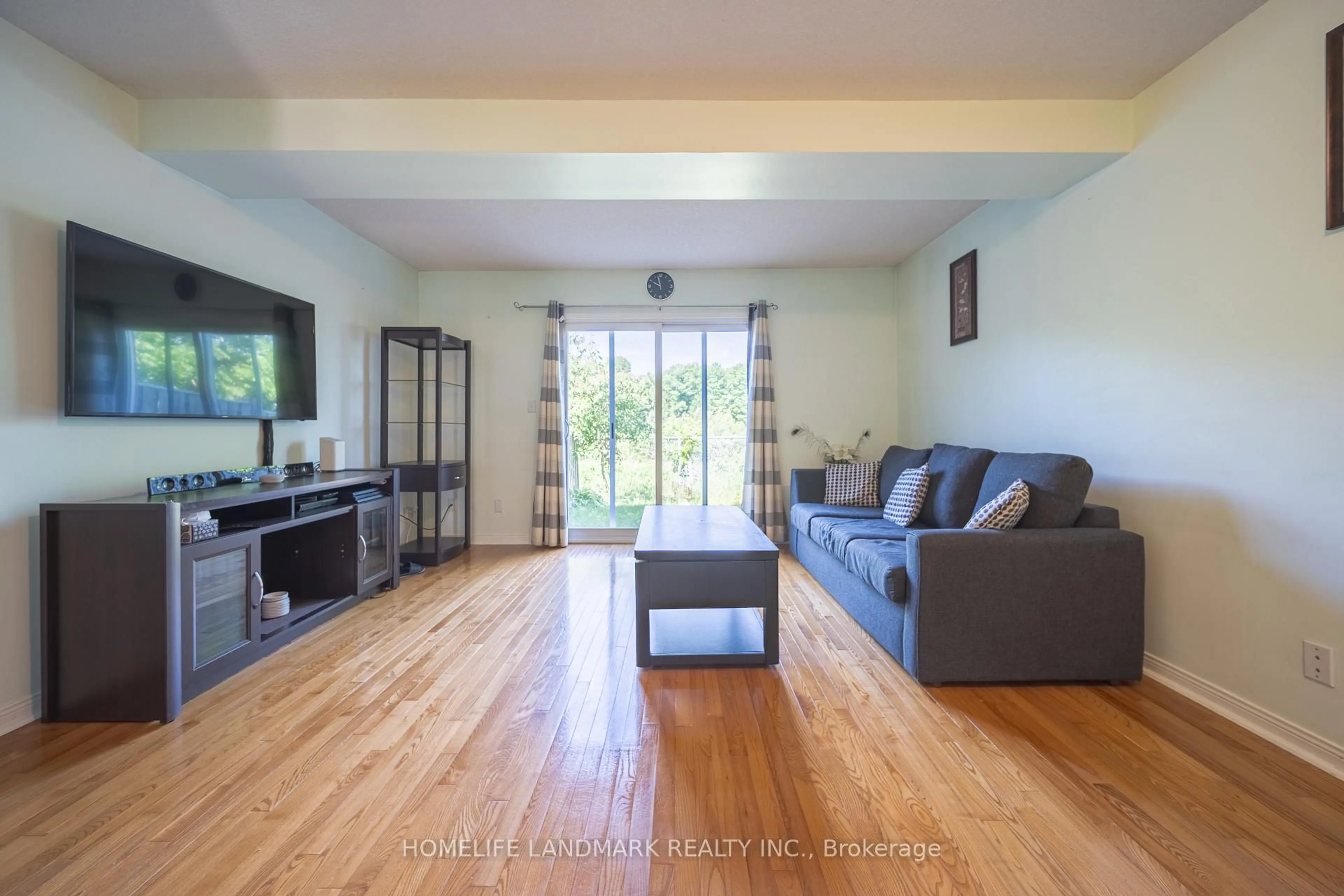 Living room with furniture, wood/laminate floor for 119 William Curtis Circ #57, Newmarket Ontario L3Y 8L8