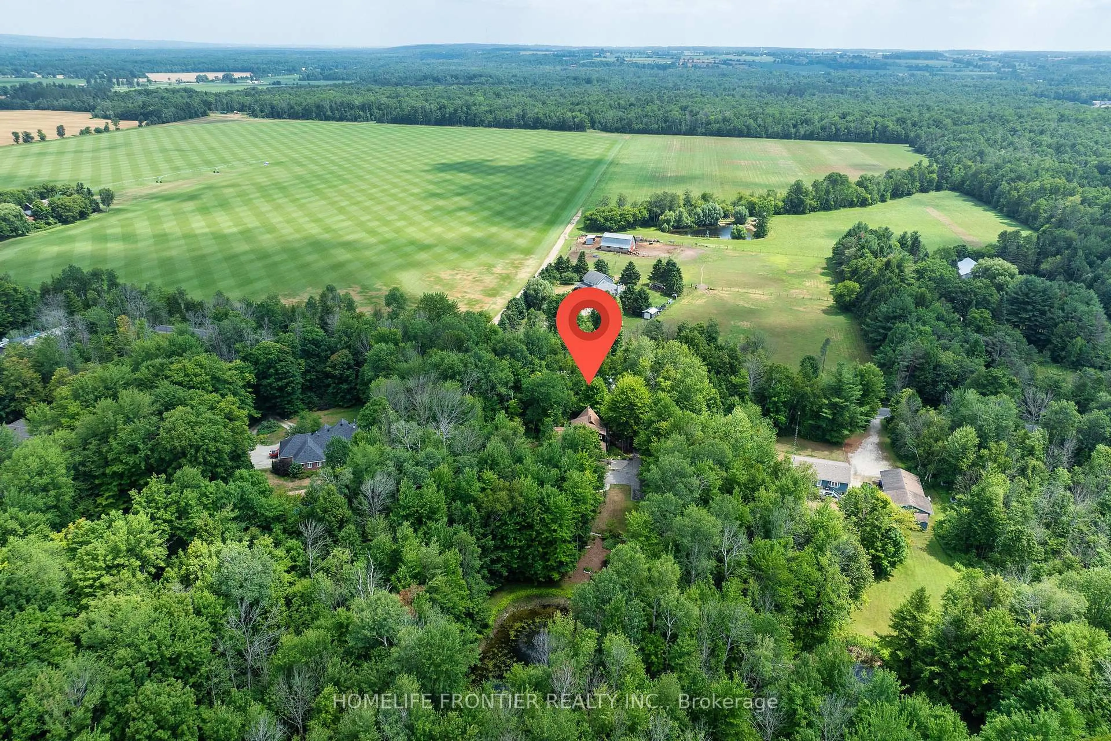 A pic from outside/outdoor area/front of a property/back of a property/a pic from drone, forest/trees view for 7896 6th Line, Essa Ontario L0M 1T0