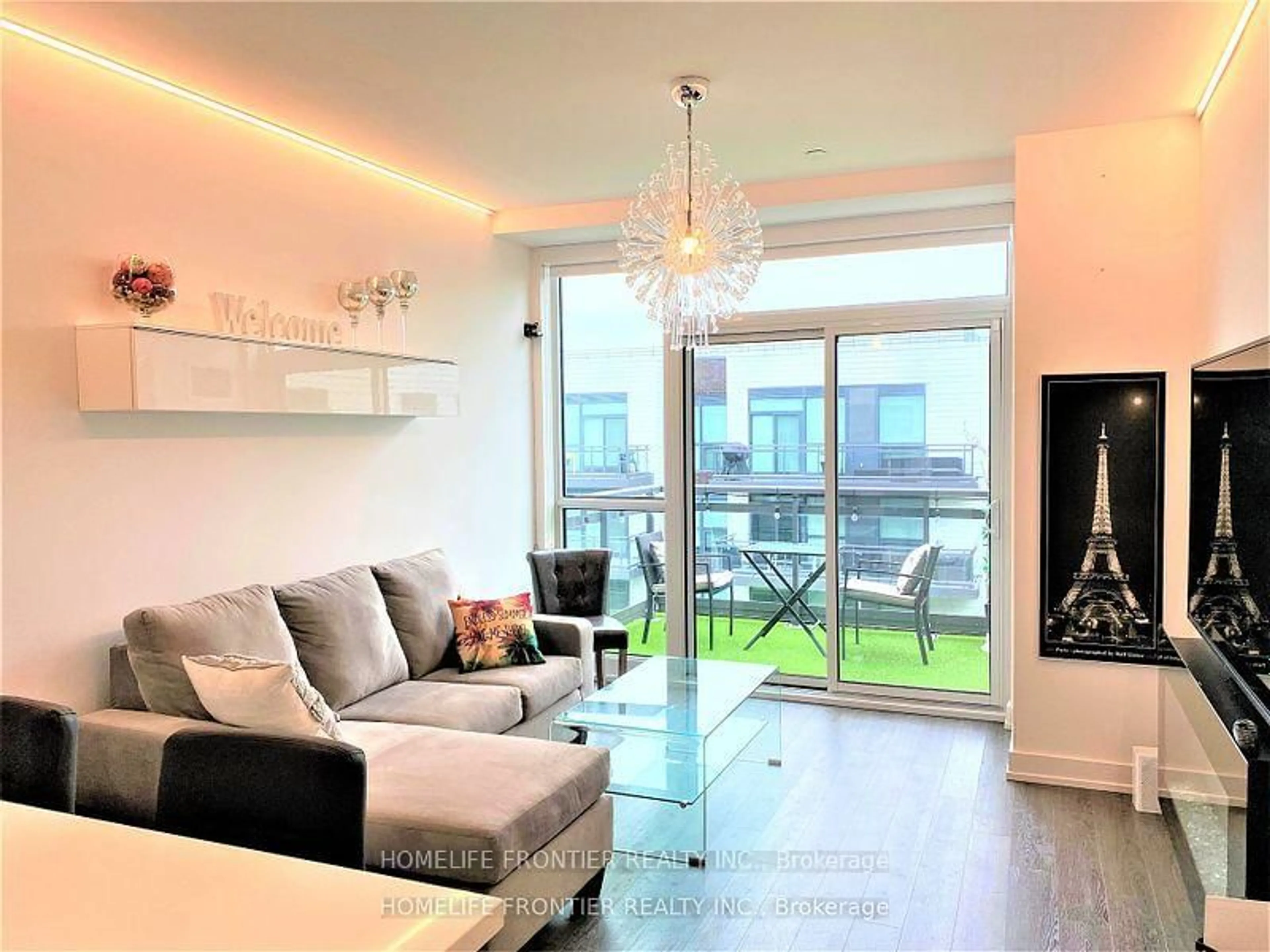 Living room with furniture, wood/laminate floor for 333 Sea Ray Ave #D430, Innisfil Ontario L9S 2P7