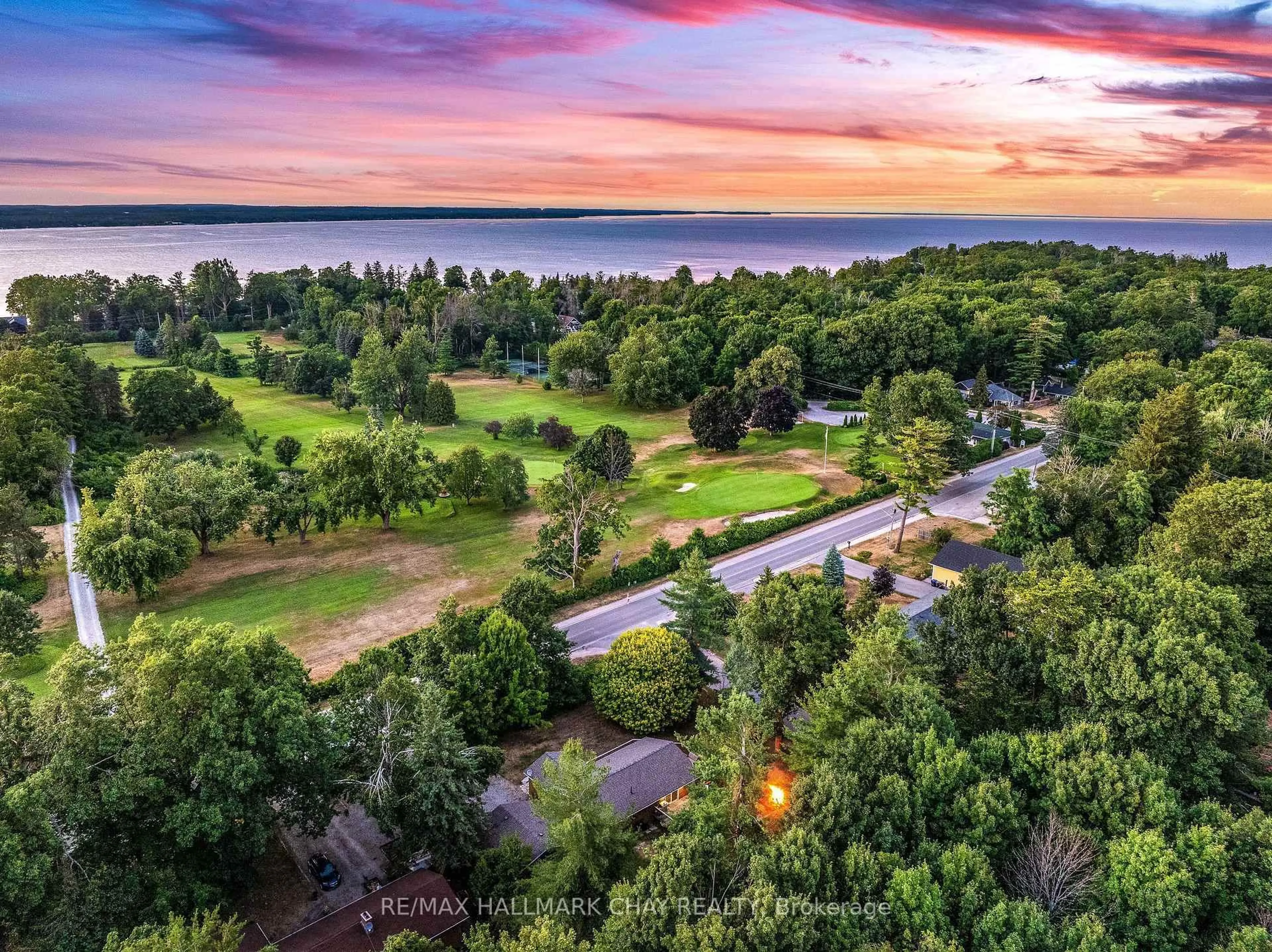 A pic from outside/outdoor area/front of a property/back of a property/a pic from drone, water/lake/river/ocean view for 135 Big Bay Point Rd, Innisfil Ontario L9S 2N3