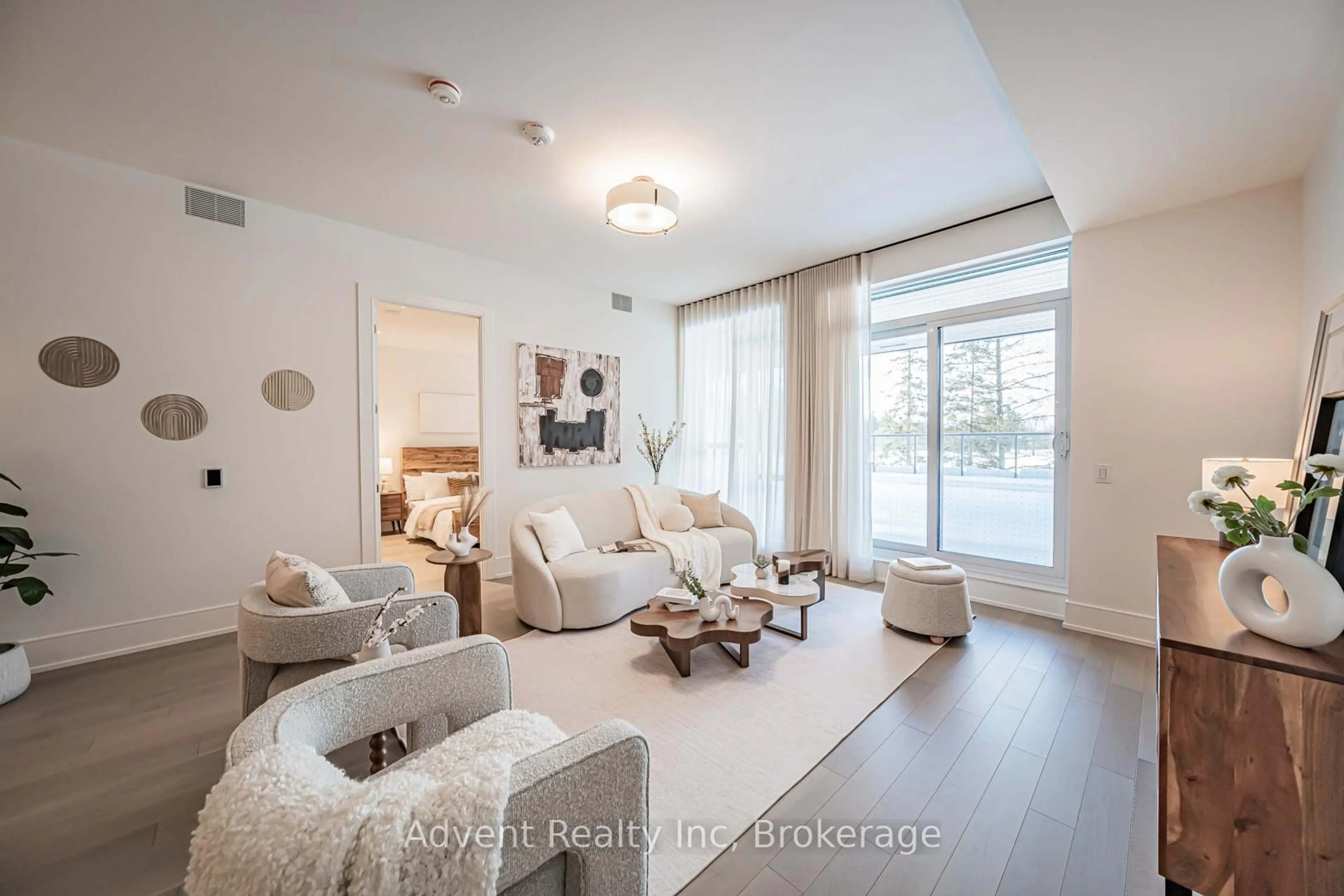 Living room with furniture, wood/laminate floor for 399 Royal Orchard Blvd #103, Markham Ontario L3T 0H3