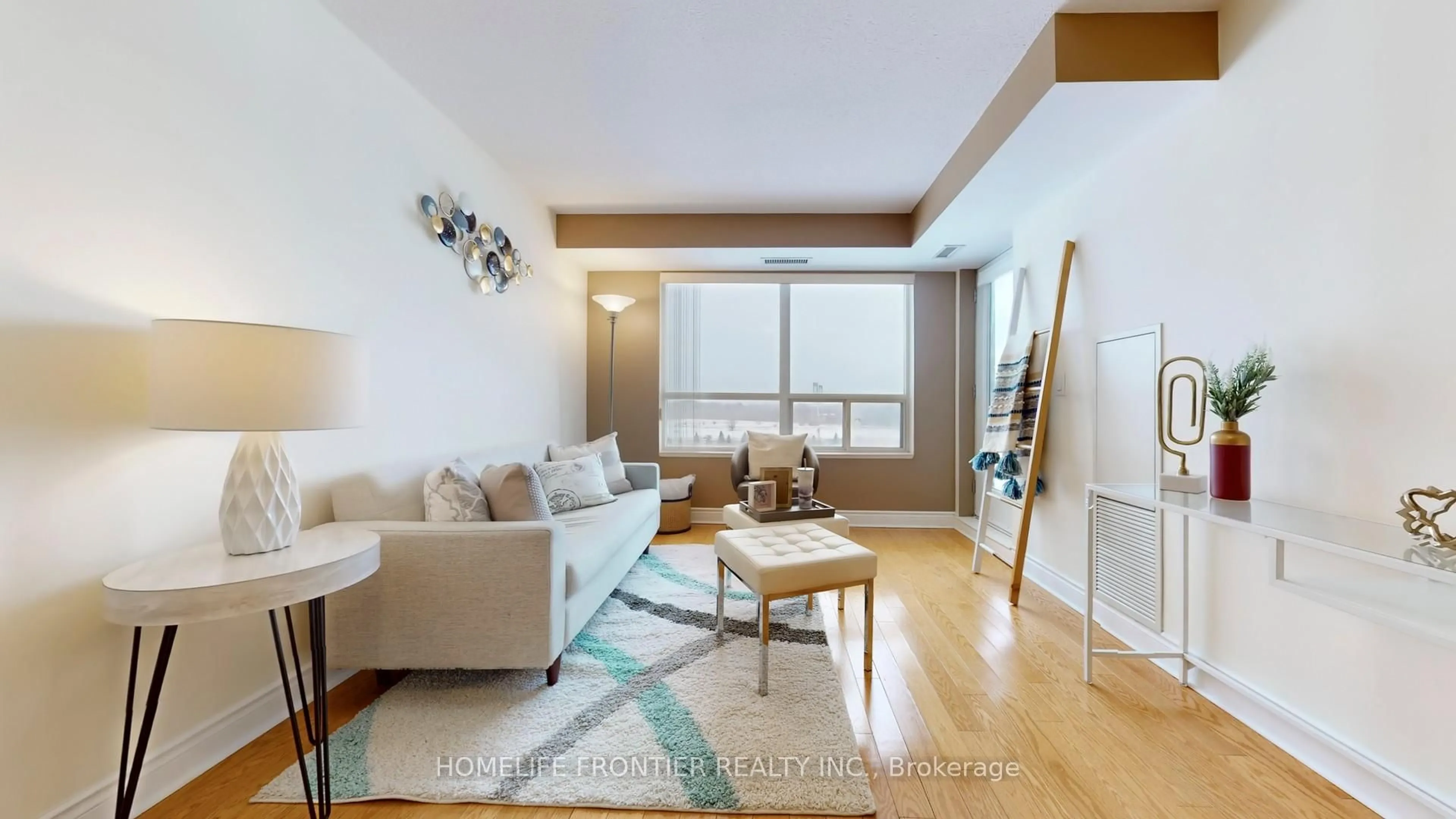 Living room with furniture, wood/laminate floor for 37 Galleria Pkwy #908, Markham Ontario L3T 0A5