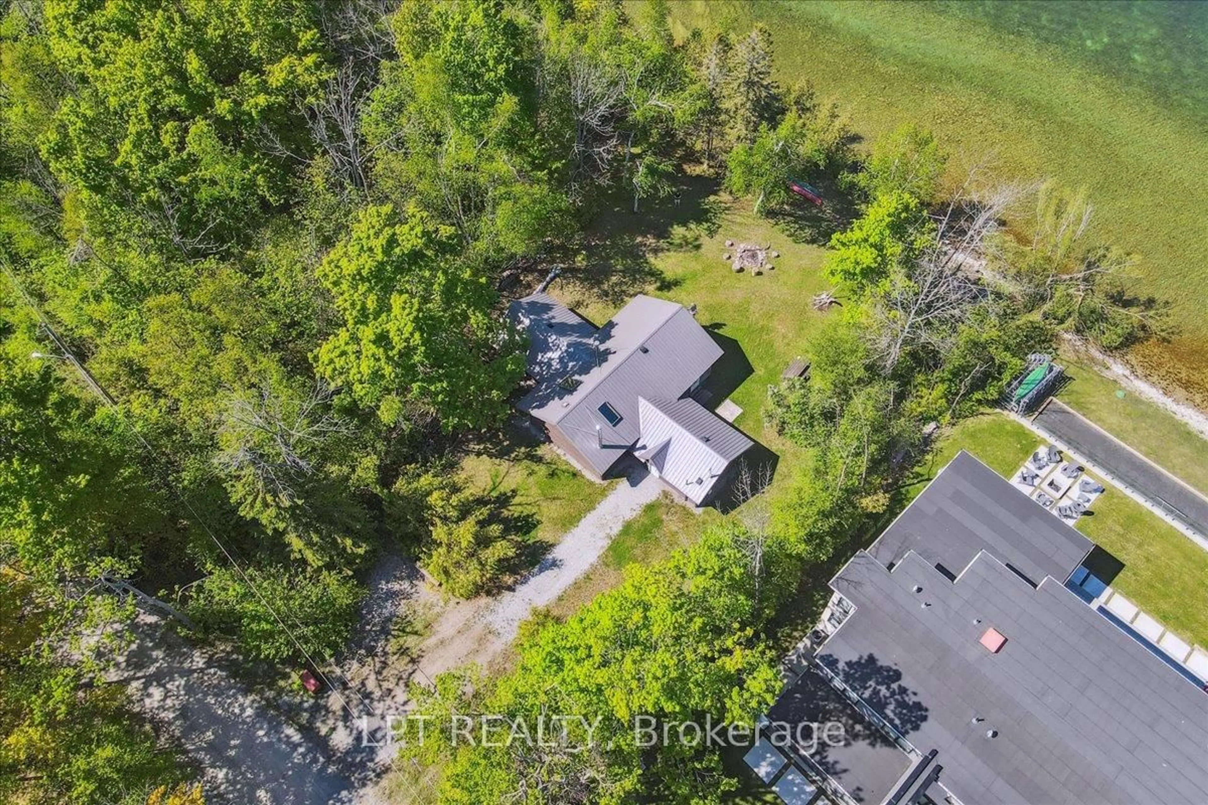 A pic from outside/outdoor area/front of a property/back of a property/a pic from drone, forest/trees view for 1689 Chief Joseph Snake Rd, Georgina Islands Ontario L0E 1R0