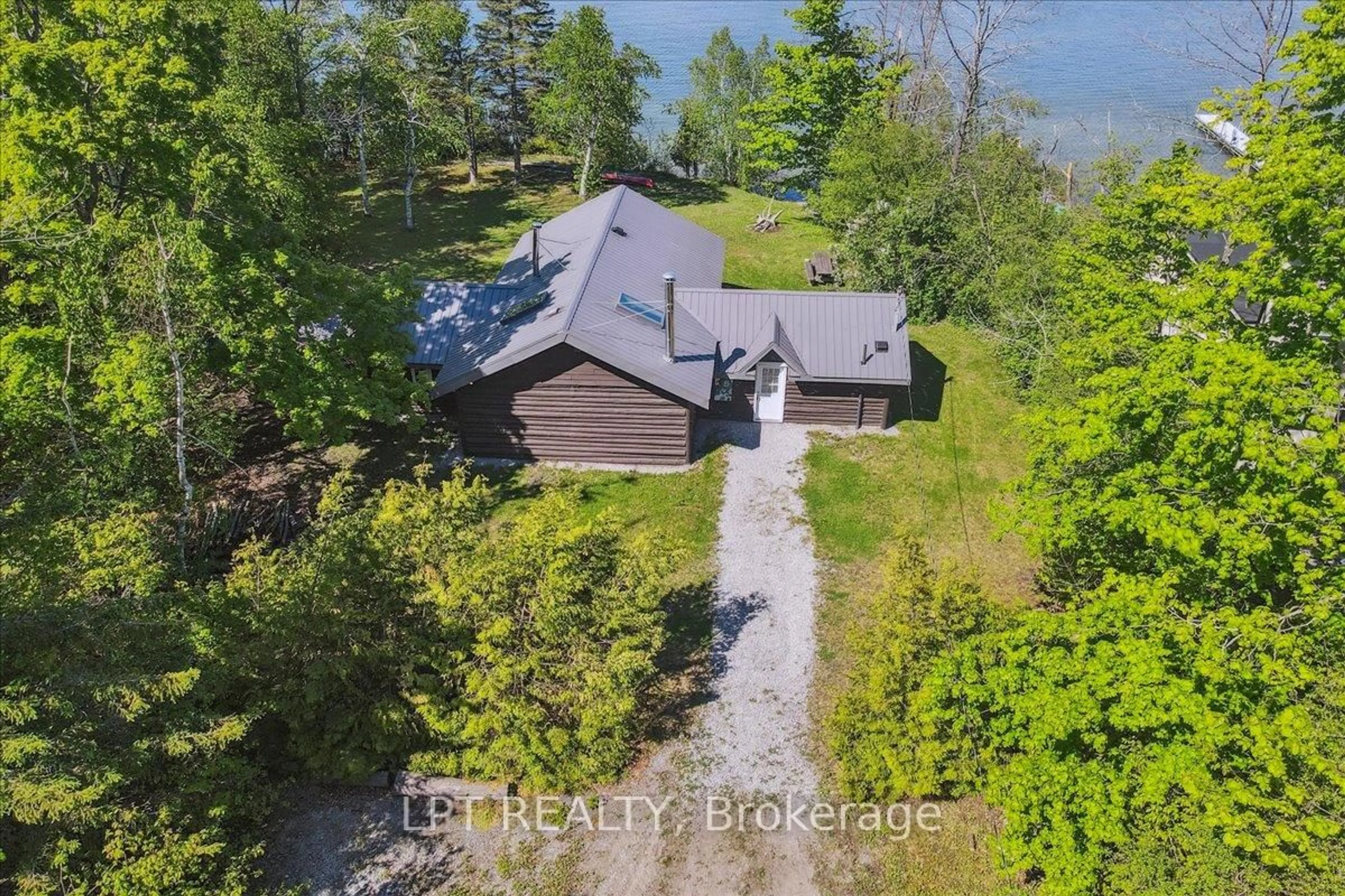A pic from outside/outdoor area/front of a property/back of a property/a pic from drone, water/lake/river/ocean view for 1689 Chief Joseph Snake Rd, Georgina Islands Ontario L0E 1R0