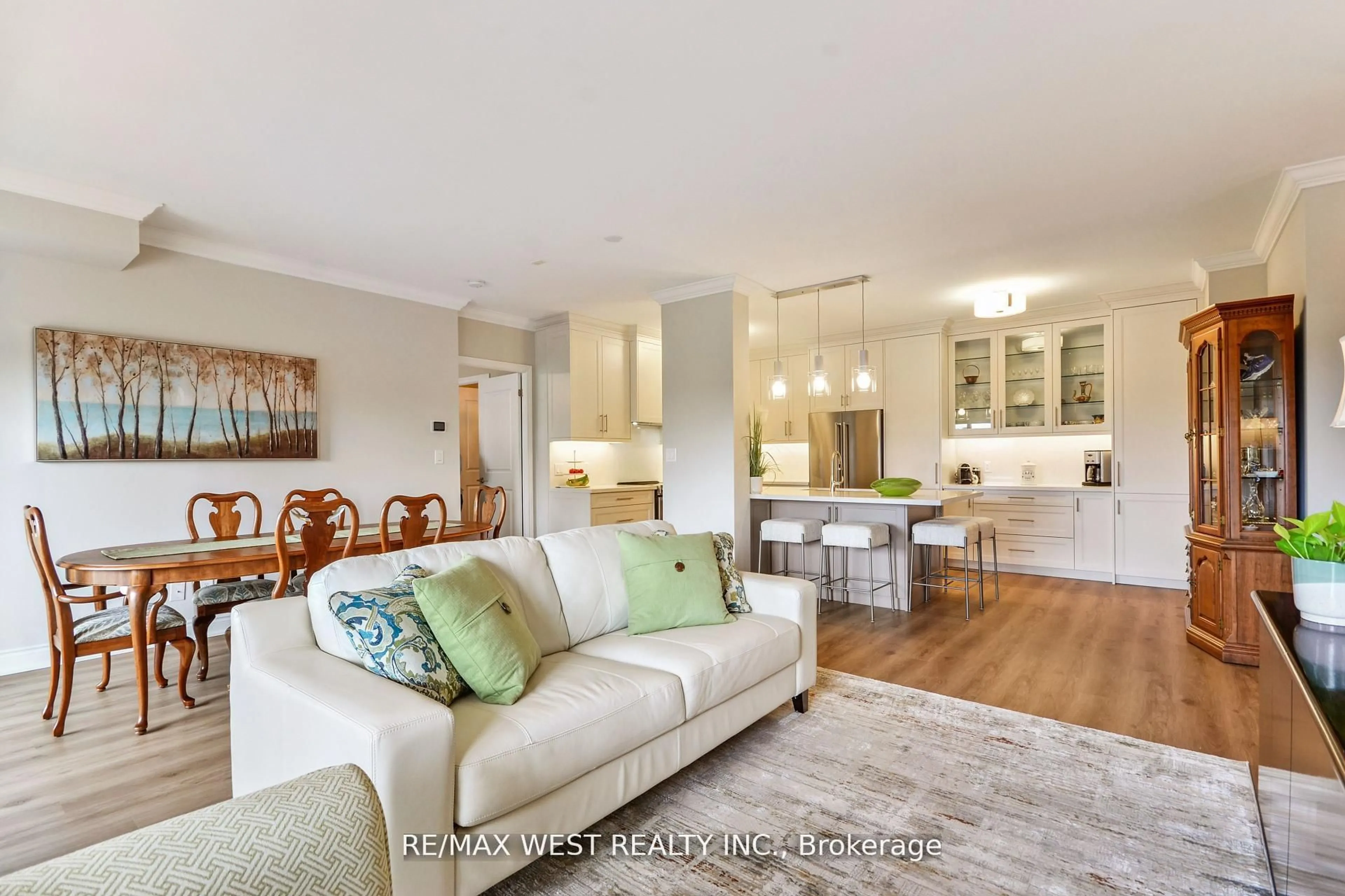 Living room with furniture, wood/laminate floor for 281 Woodbridge Ave #321, Vaughan Ontario L4L 0C6