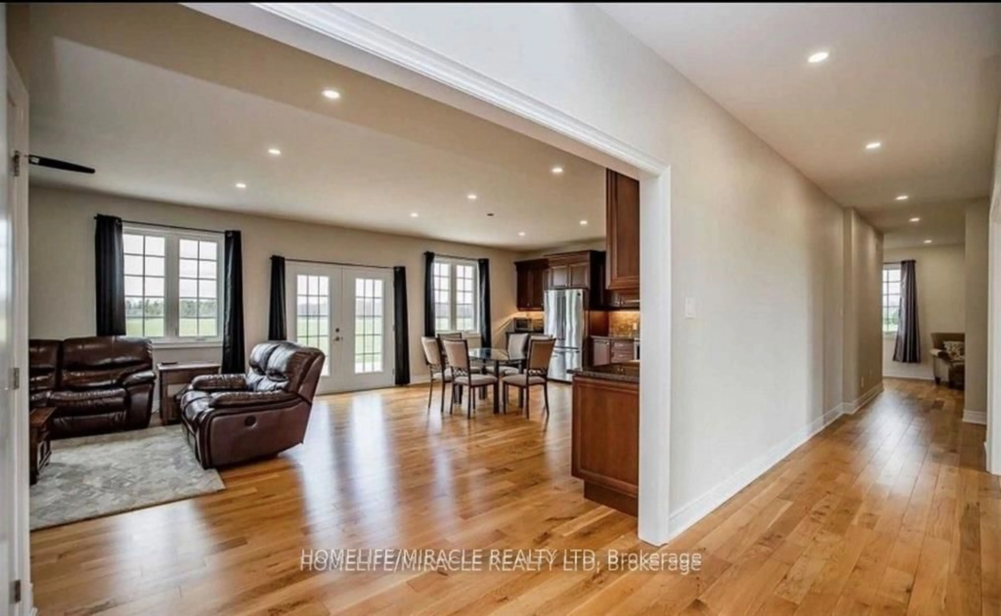 Open concept kitchen, wood/laminate floor for 8480 Simcoe County Rd #1, Adjala-Tosorontio Ontario L0G 1L0