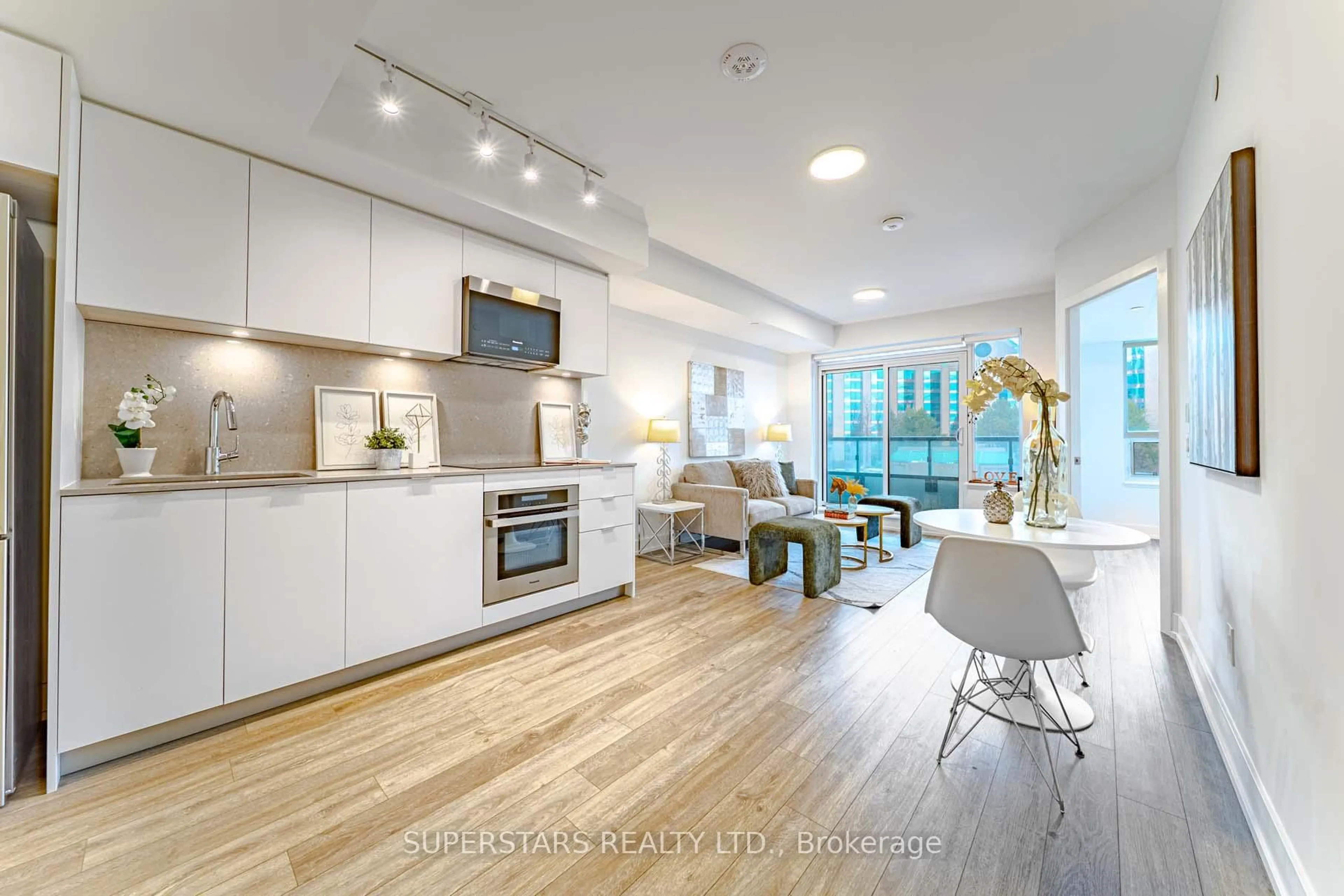 Open concept kitchen, wood/laminate floor for 9 Clegg Rd #712, Markham Ontario L6G 0H3