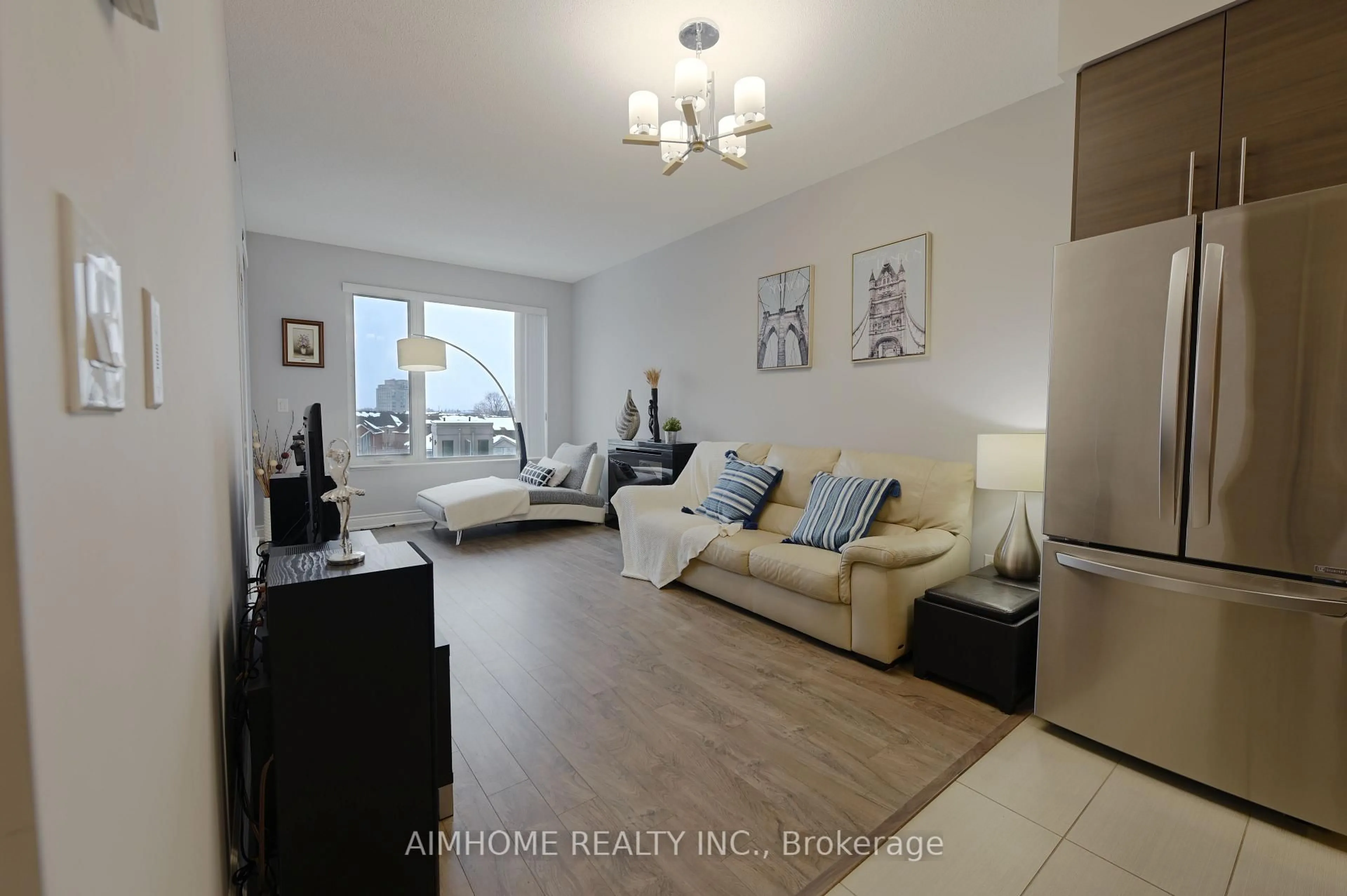 Living room with furniture, wood/laminate floor for 277 South Park Rd #602, Markham Ontario L3T 0B7