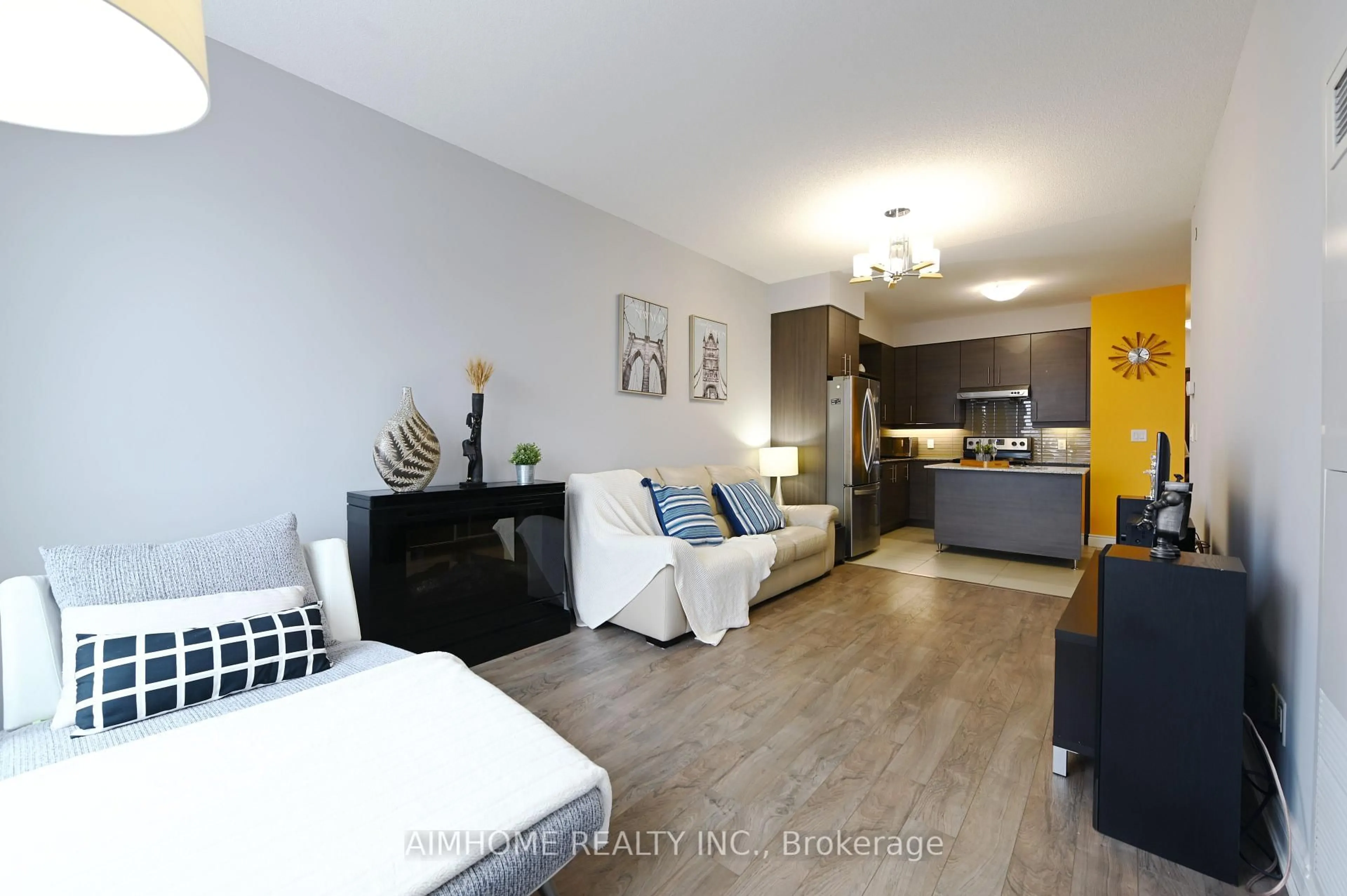 Living room with furniture, wood/laminate floor for 277 South Park Rd #602, Markham Ontario L3T 0B7