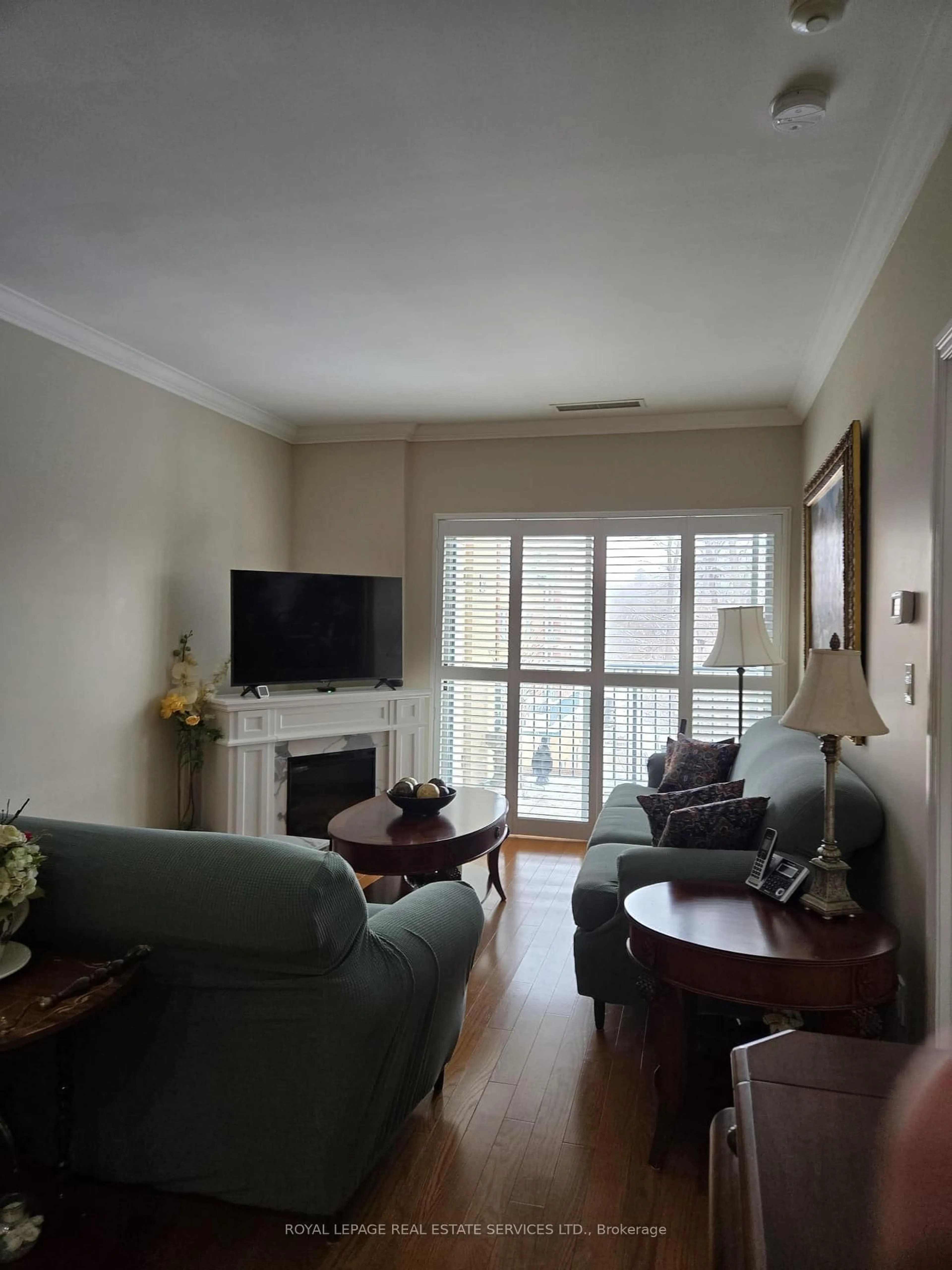Living room with furniture, wood/laminate floor for 33 Wallace St #303, Vaughan Ontario L4L 2P2