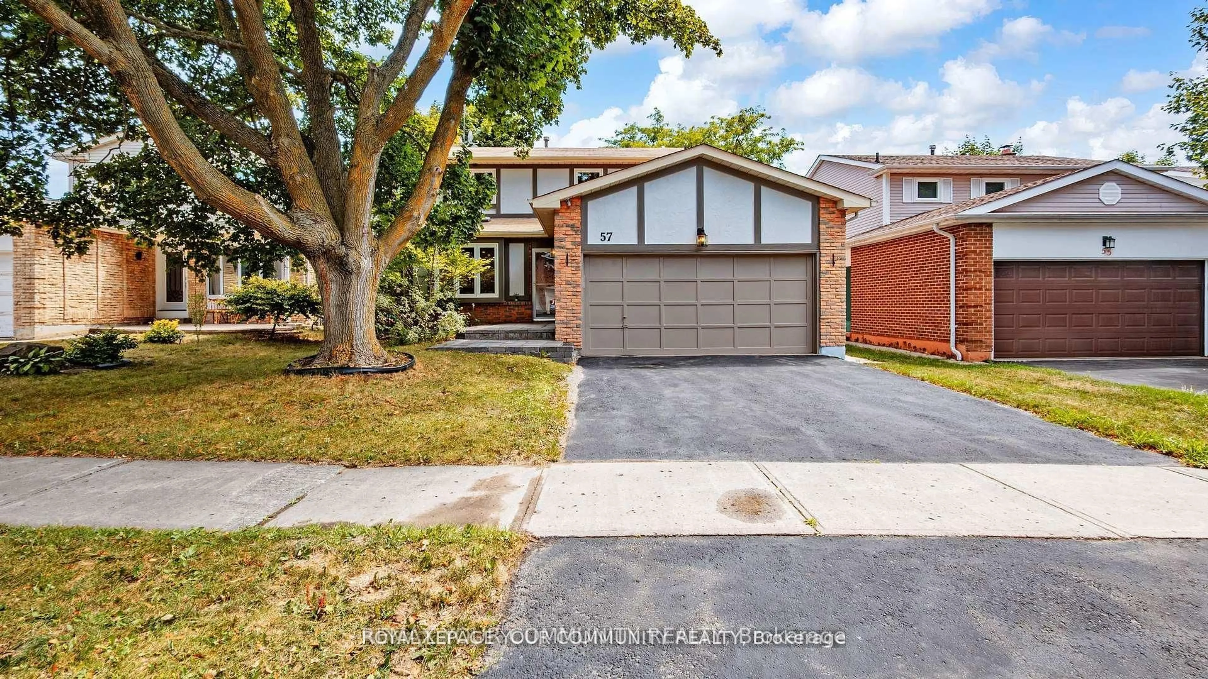 Home with brick exterior material, street for 57 Braeburn Dr, Markham Ontario L3T 4W7