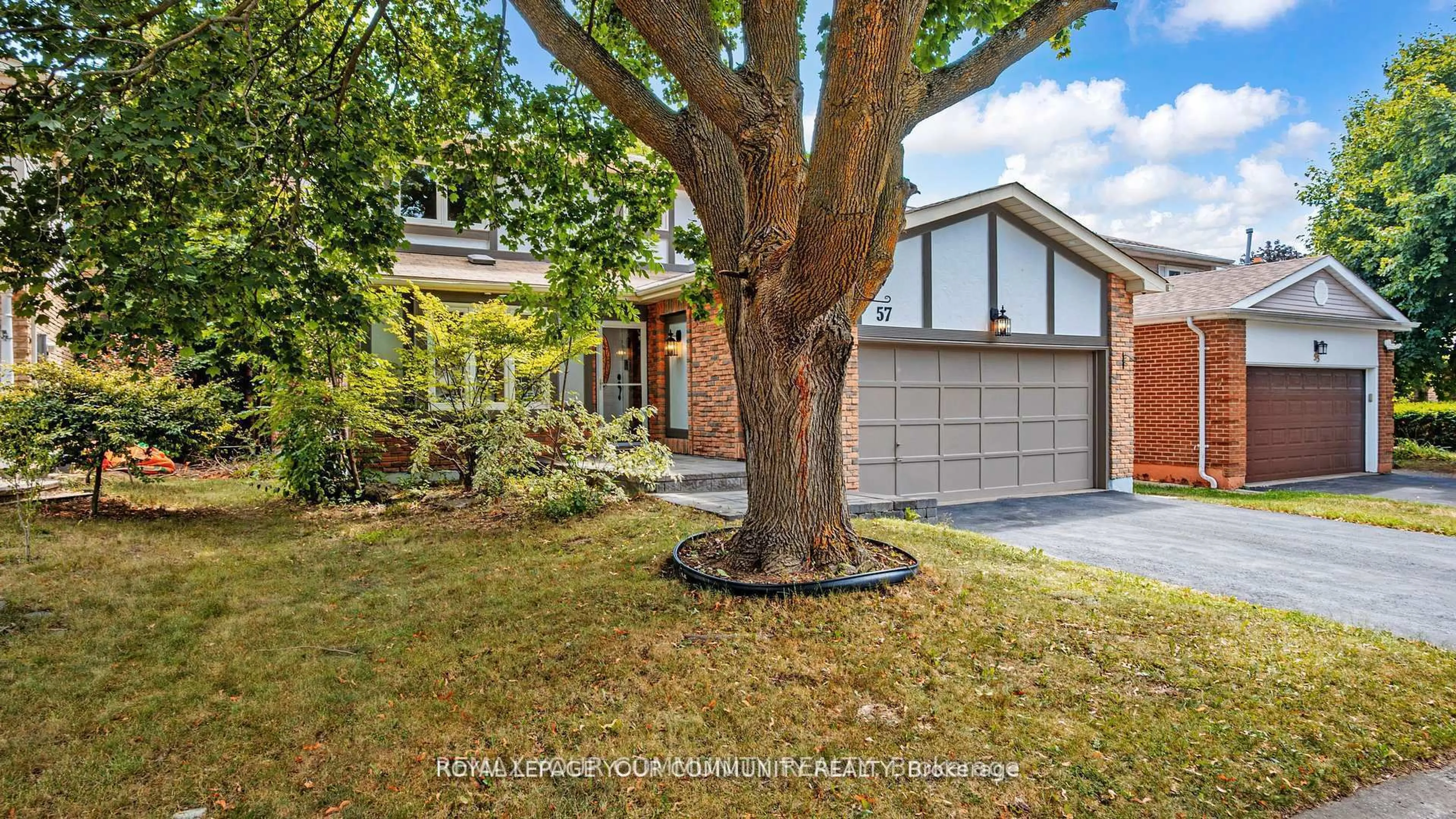 Home with brick exterior material, street for 57 Braeburn Dr, Markham Ontario L3T 4W7