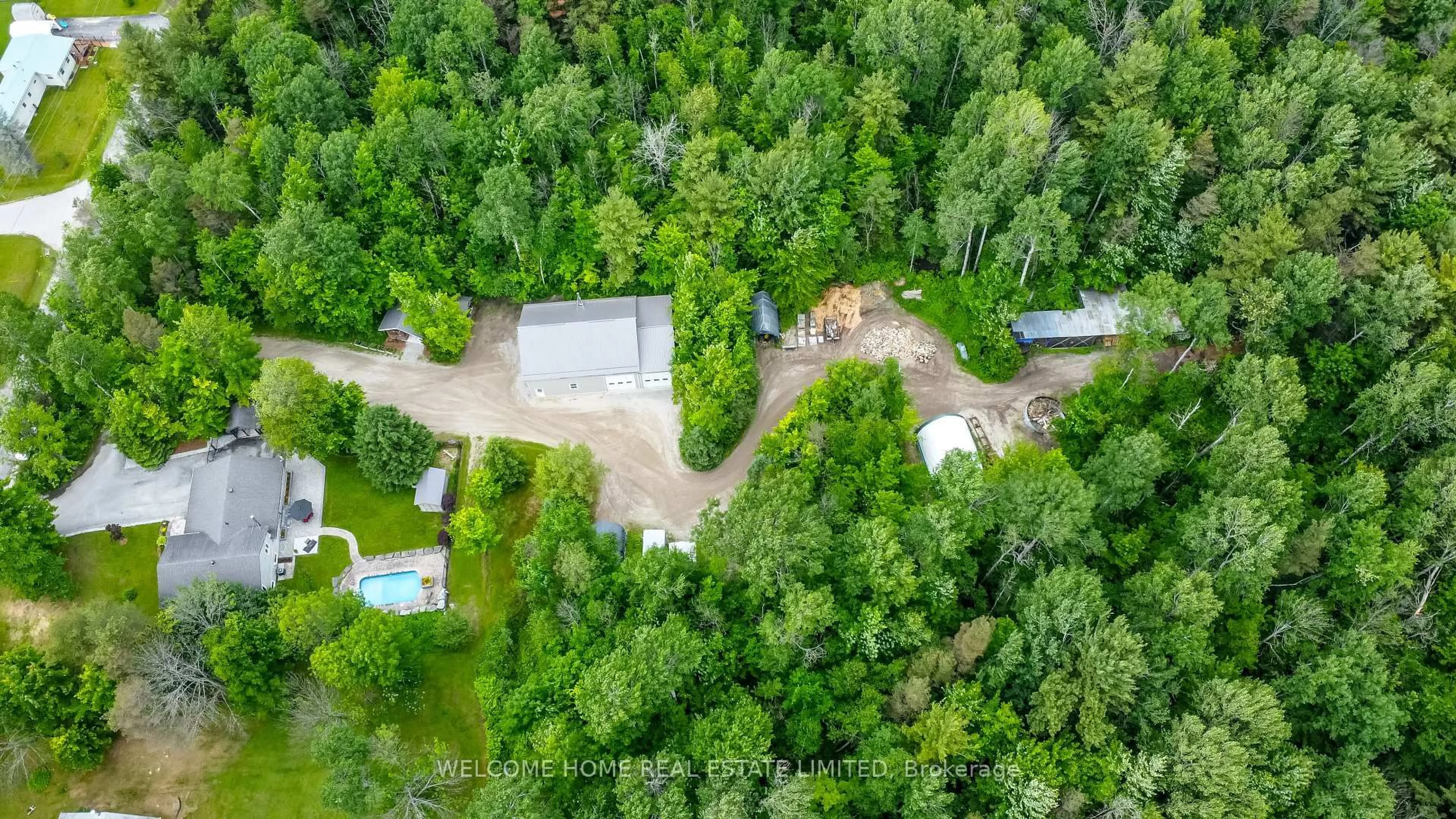 A pic from outside/outdoor area/front of a property/back of a property/a pic from drone, forest/trees view for 8071 4th Line, Essa Ontario L0M 1B1