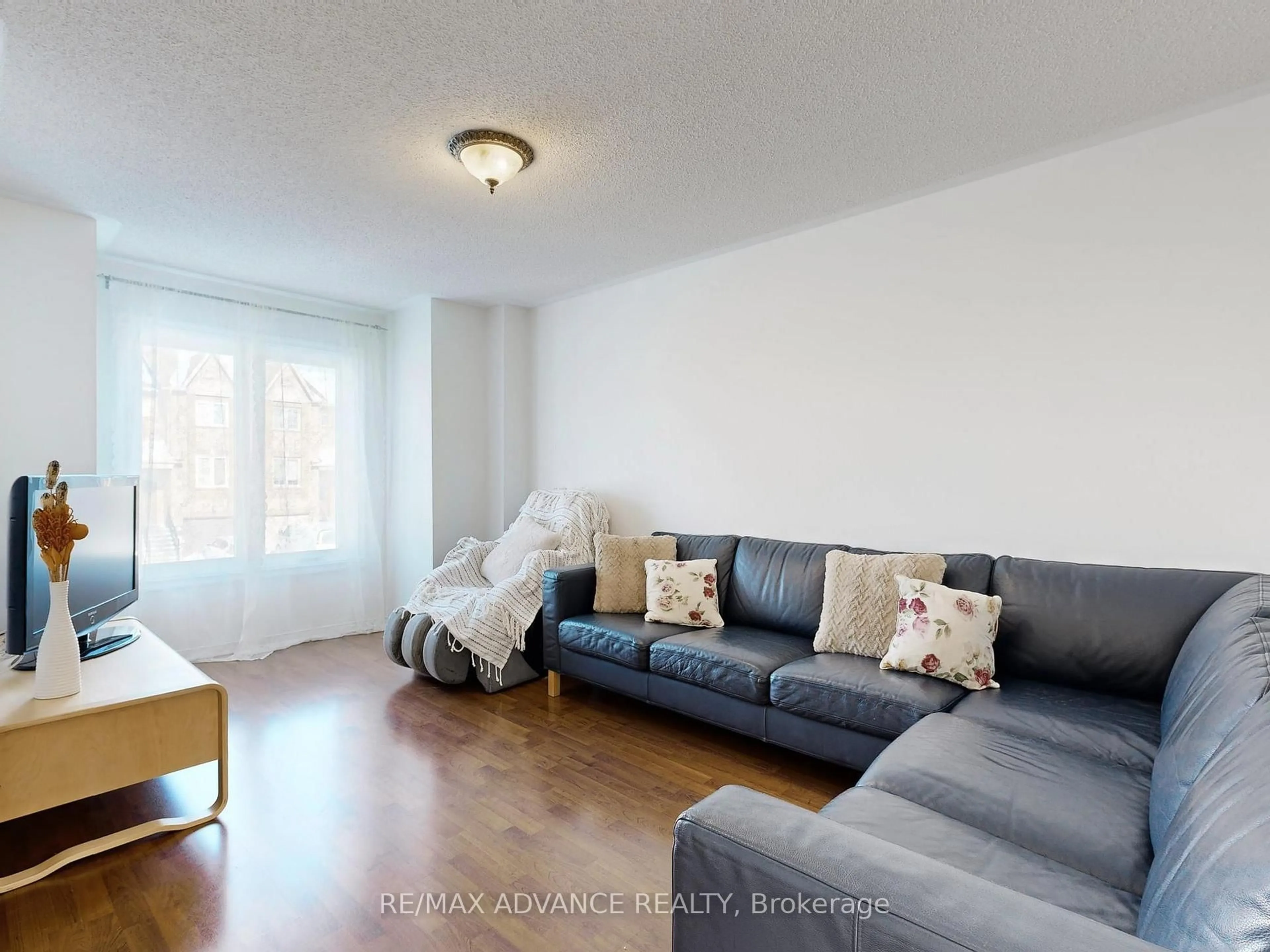 Living room with furniture, wood/laminate floor for 67 Kelso Cres, Vaughan Ontario L6A 2C8