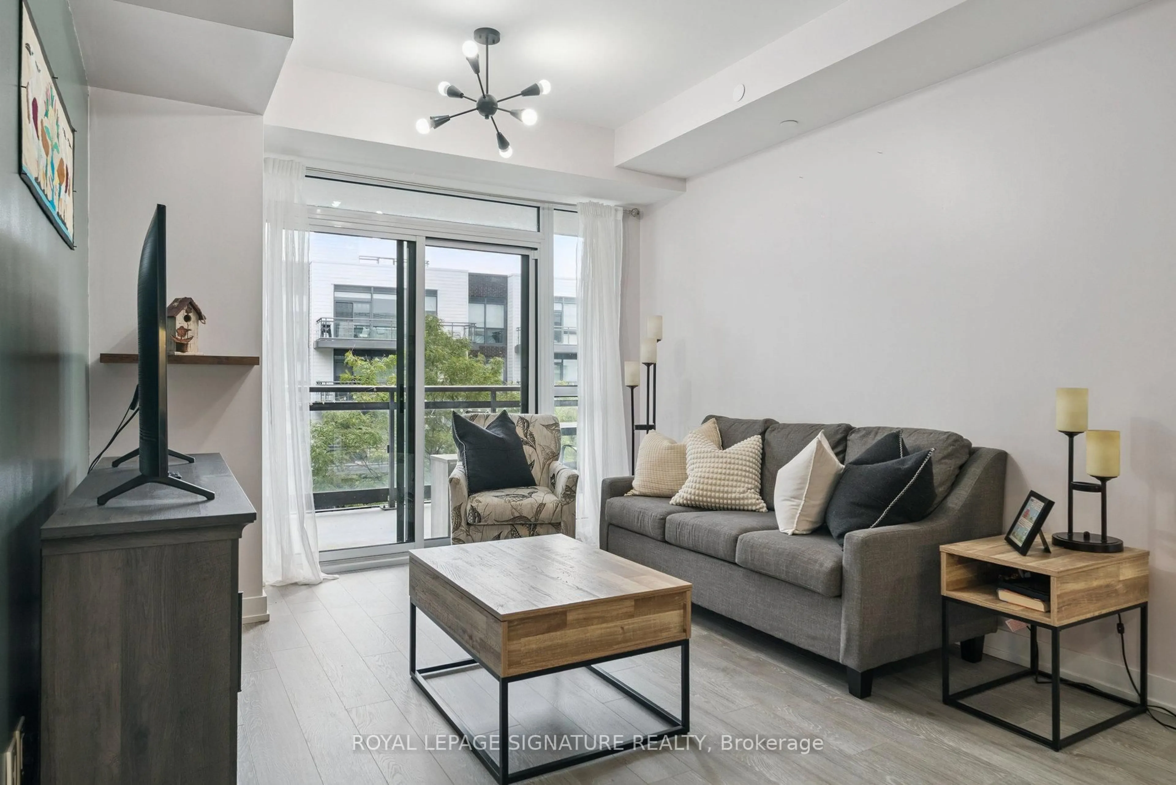 Living room with furniture, unknown for 301 Sea Ray Ave #C305, Innisfil Ontario L9S 0L8