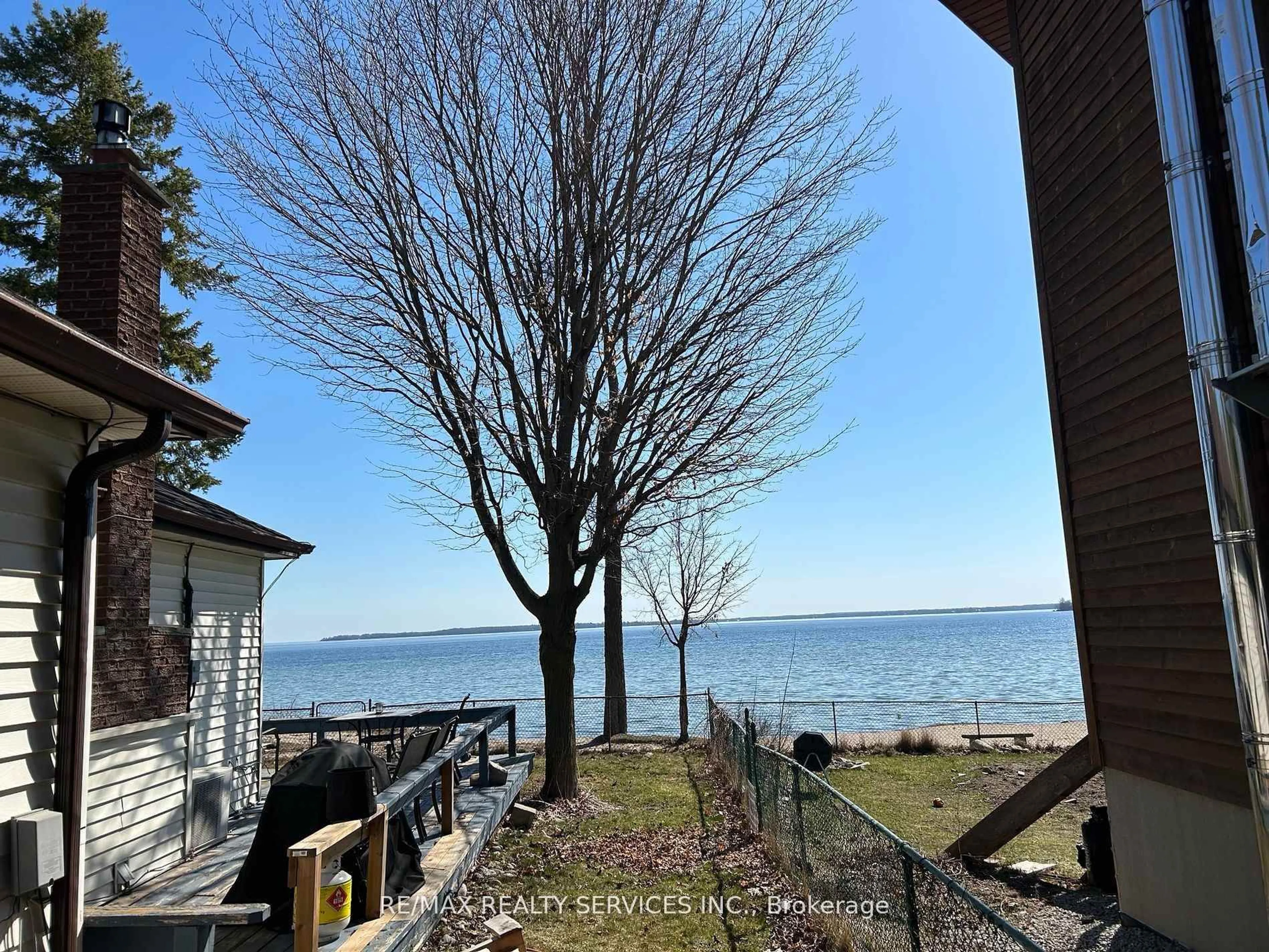 A pic from outside/outdoor area/front of a property/back of a property/a pic from drone, water/lake/river/ocean view for 907 Adams Rd, Innisfil Ontario L9S 4C9