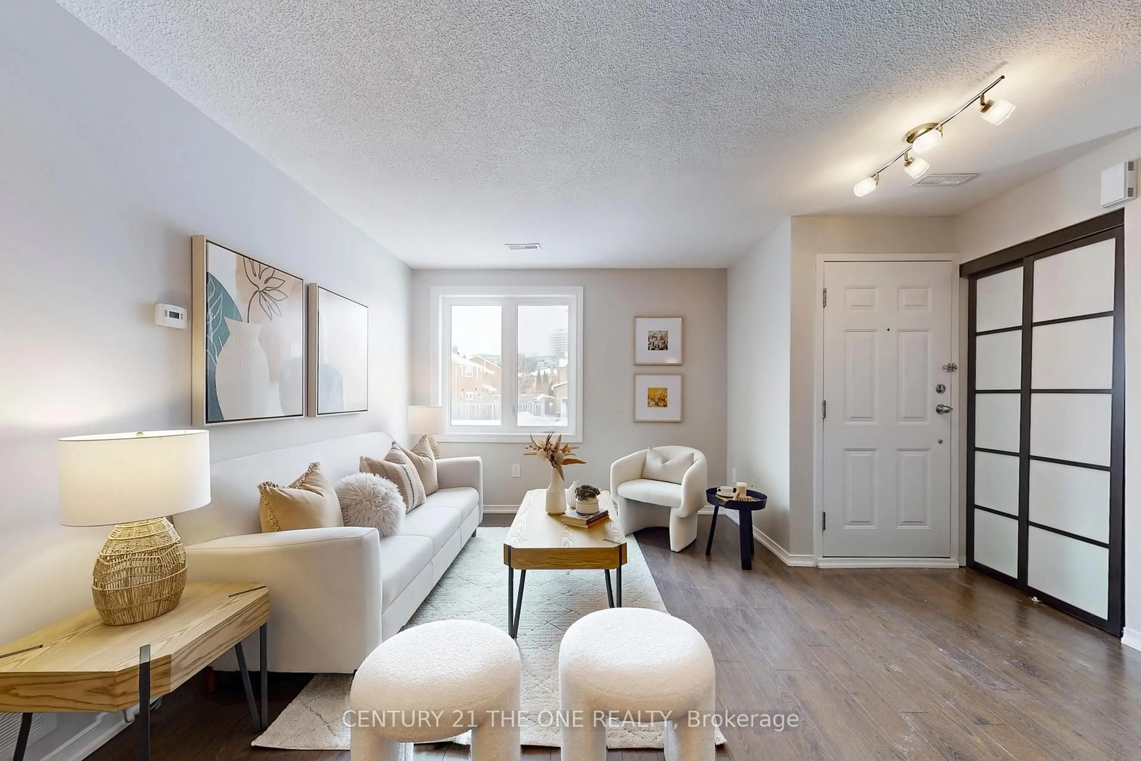 Living room with furniture, wood/laminate floor for 75 Weldrick Rd #1004, Richmond Hill Ontario L4C 0H9