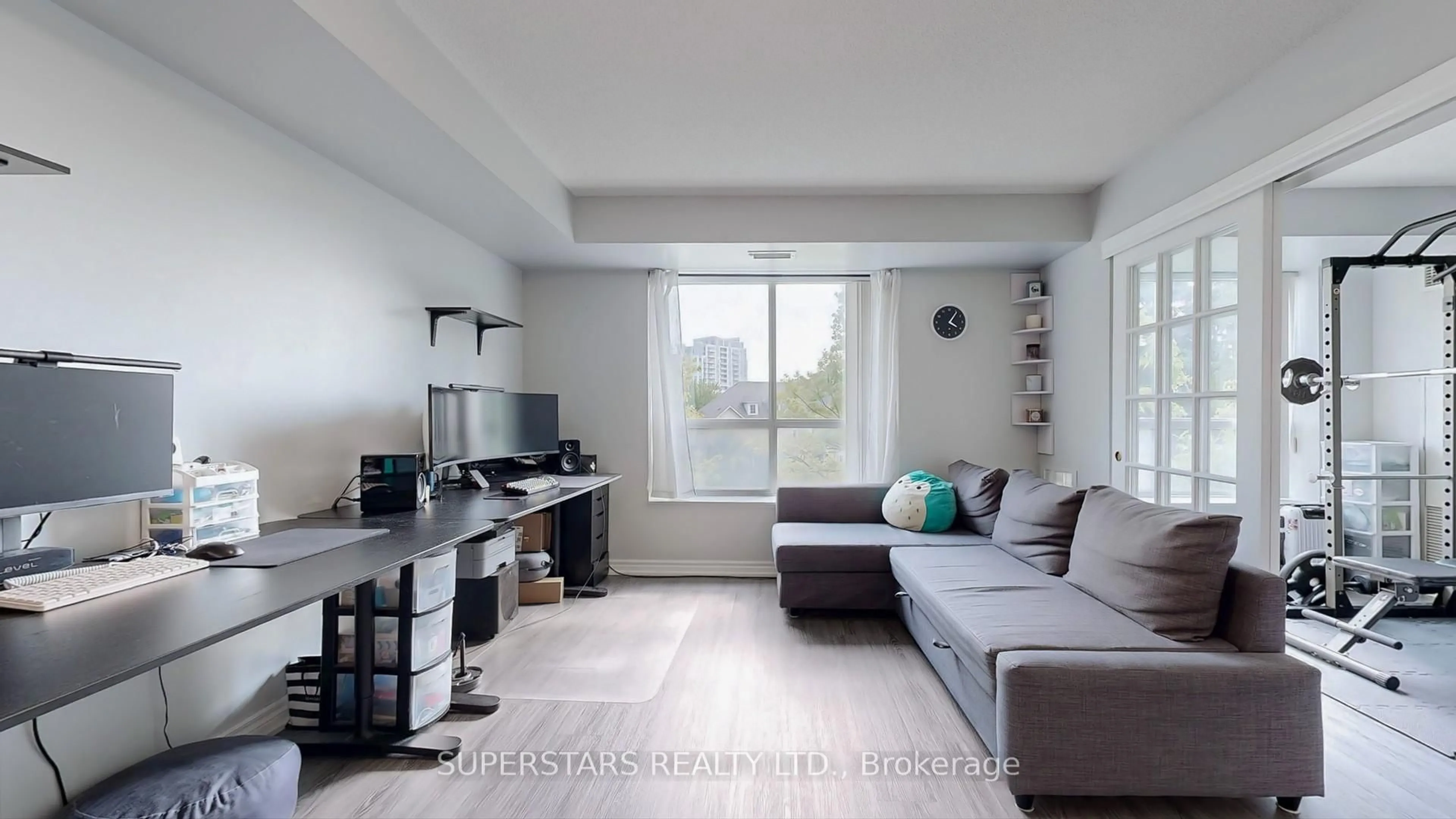 Living room with furniture, wood/laminate floor for 3 Ellesmere St #217, Richmond Hill Ontario L4B 4N2