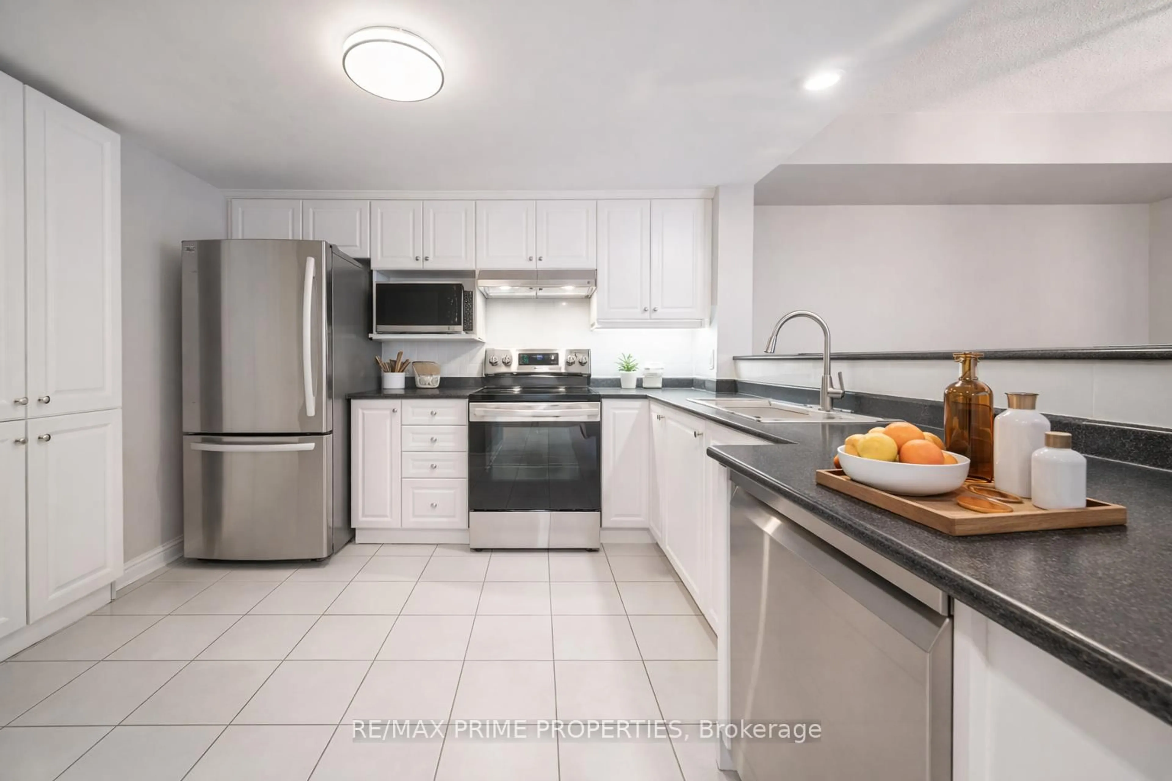 Standard kitchen, ceramic/tile floor for 85 The Boardwalk Way #320, Markham Ontario L6E 1B9