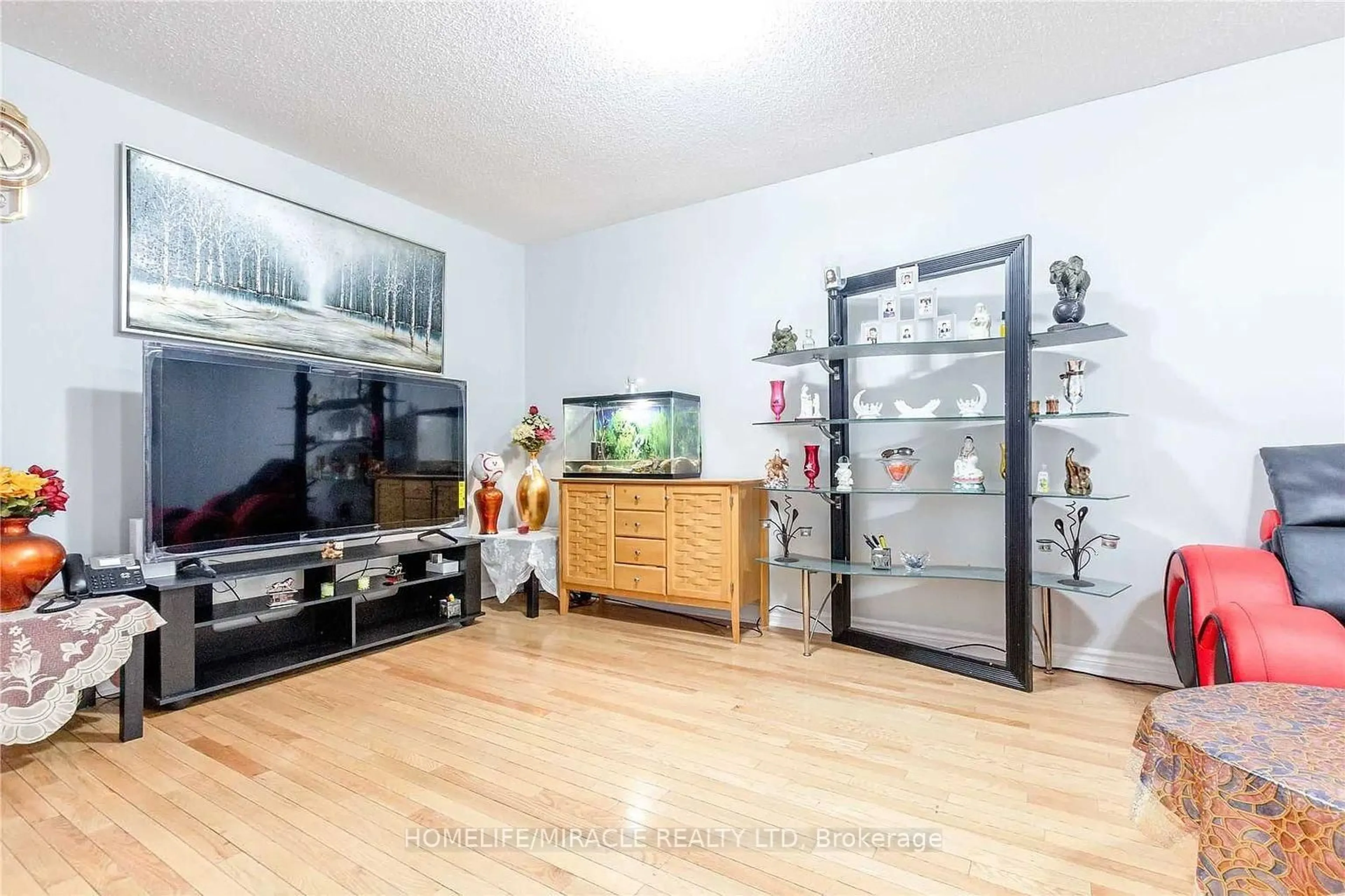 Living room with furniture, wood/laminate floor for 98 Laird Dr, Markham Ontario L3S 3N5