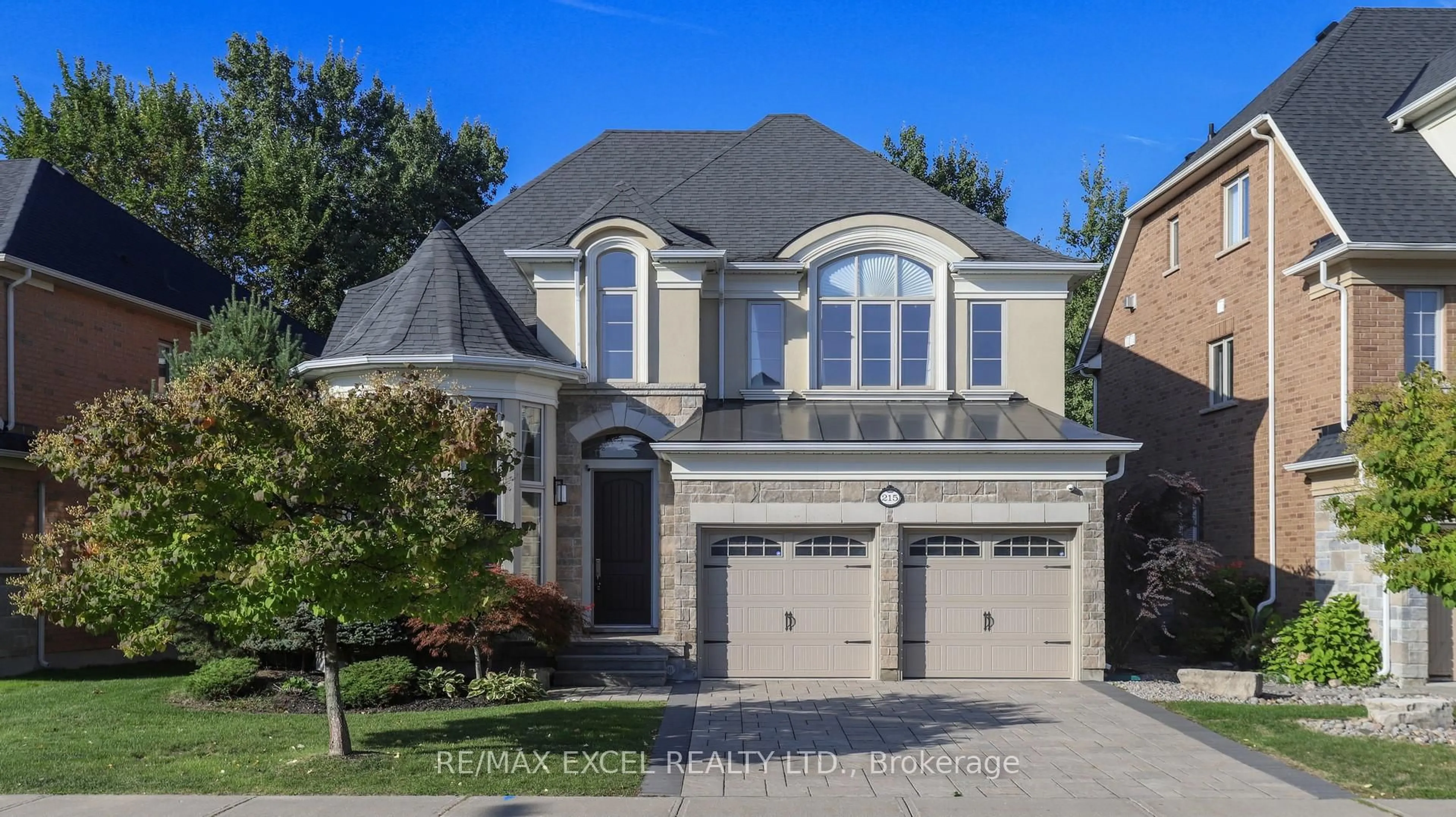 Home with brick exterior material, street for 215 Coon's Rd, Richmond Hill Ontario L4E 4R3