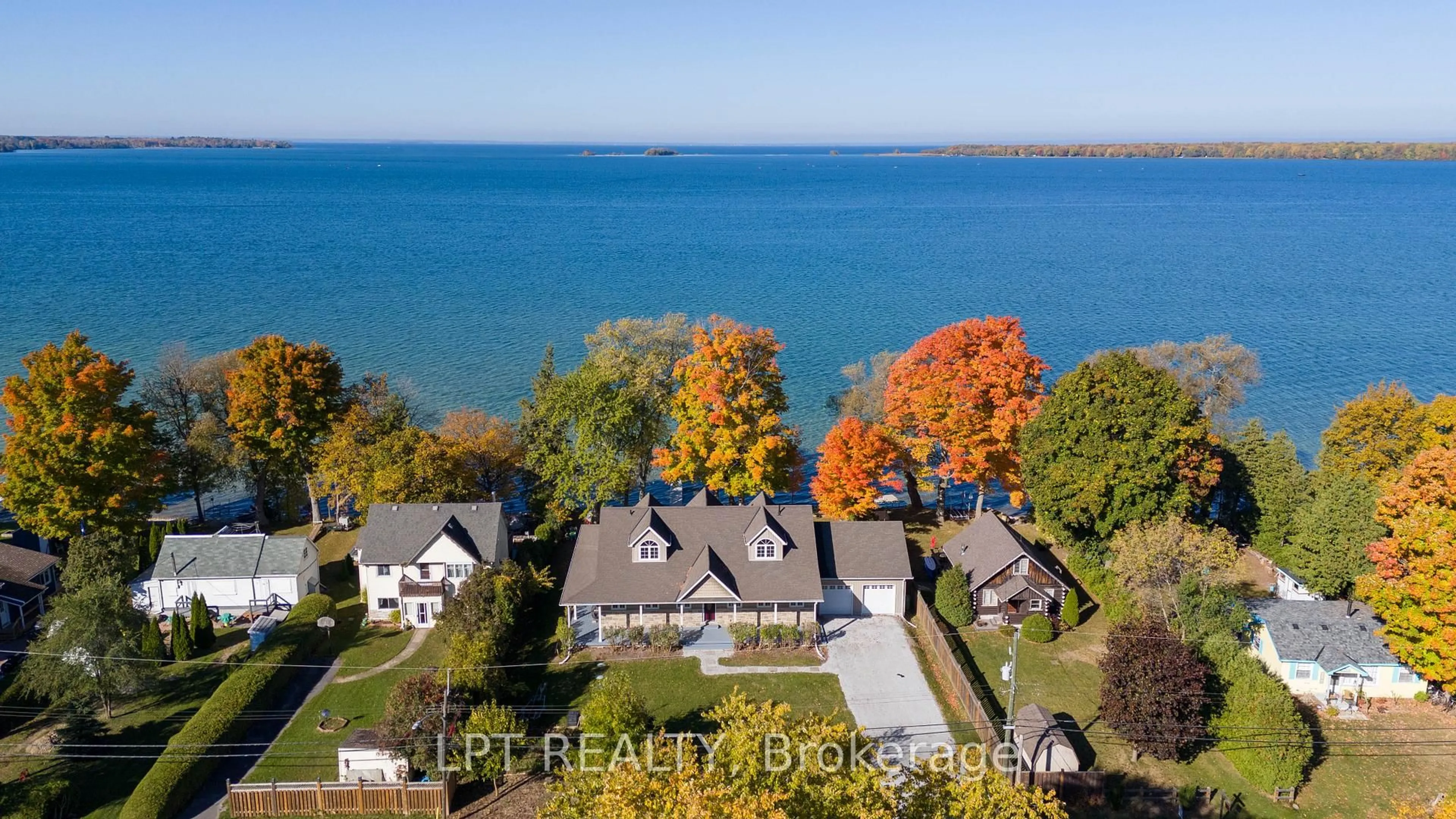 A pic from outside/outdoor area/front of a property/back of a property/a pic from drone, water/lake/river/ocean view for 22 Blue Heron Dr, Georgina Ontario L0E 1N0