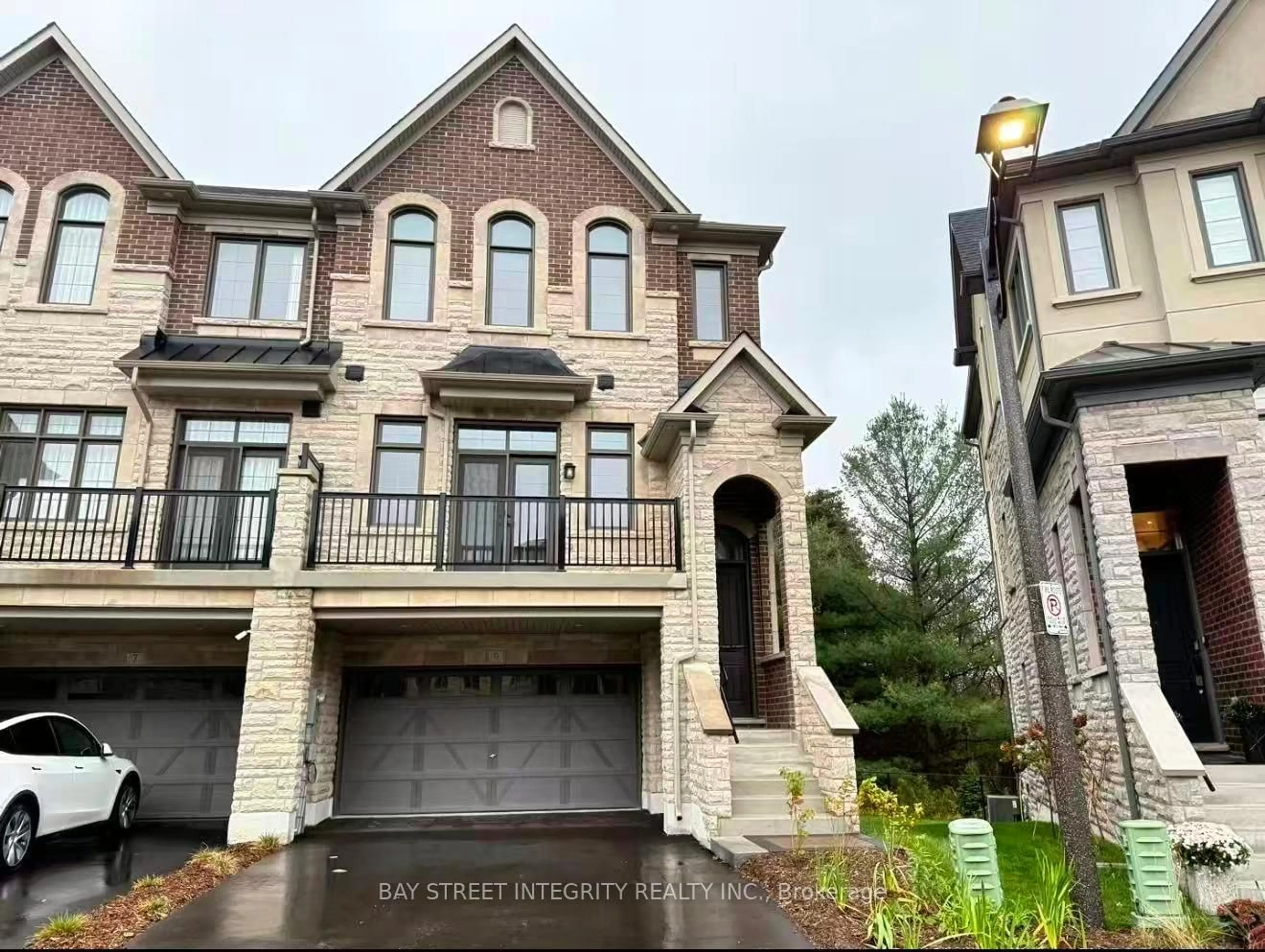 Home with brick exterior material, street for 9 West Village Lane, Markham Ontario L6C 3L5