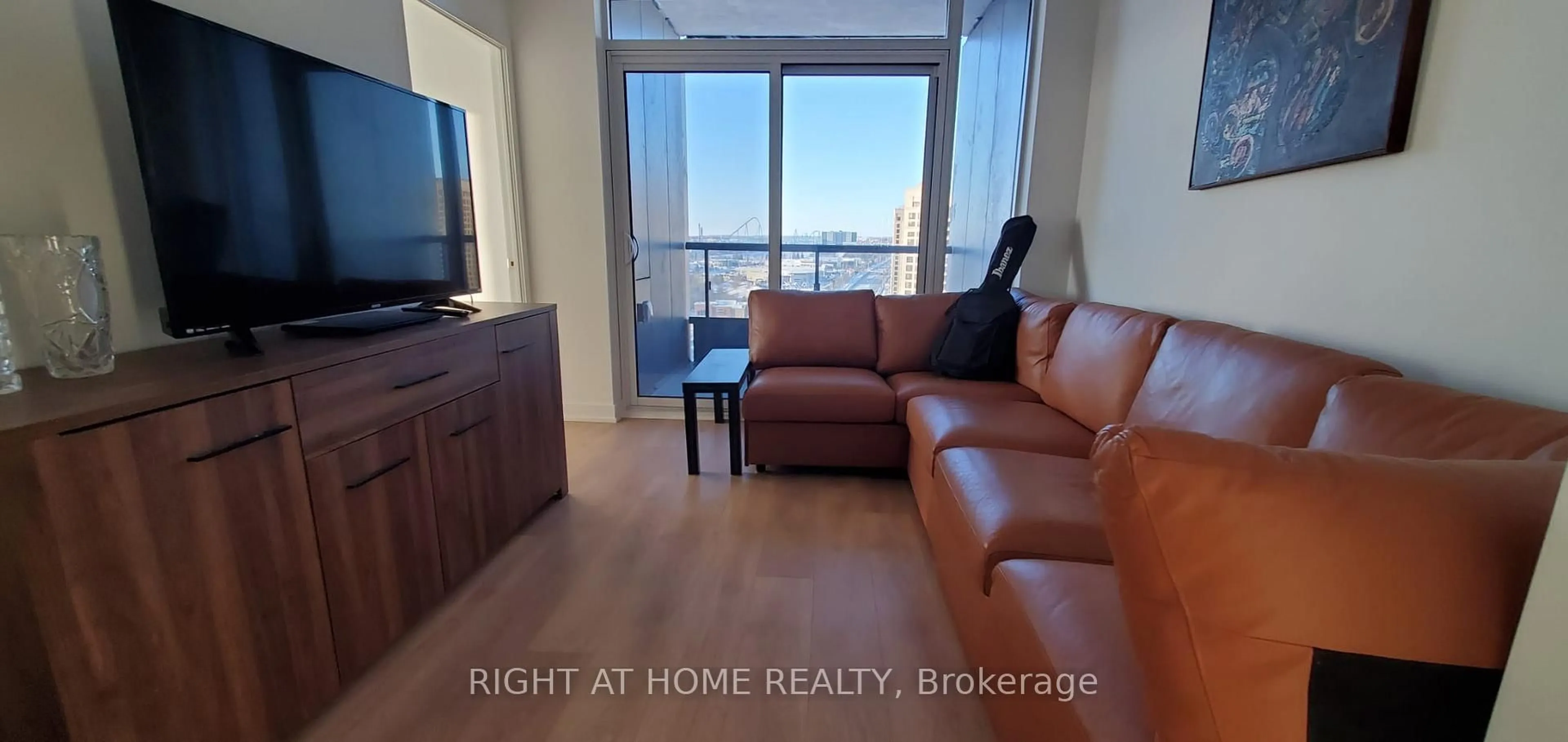 Living room with furniture, wood/laminate floor for 498 Caldari Rd #1124, Vaughan Ontario L4K 0R6