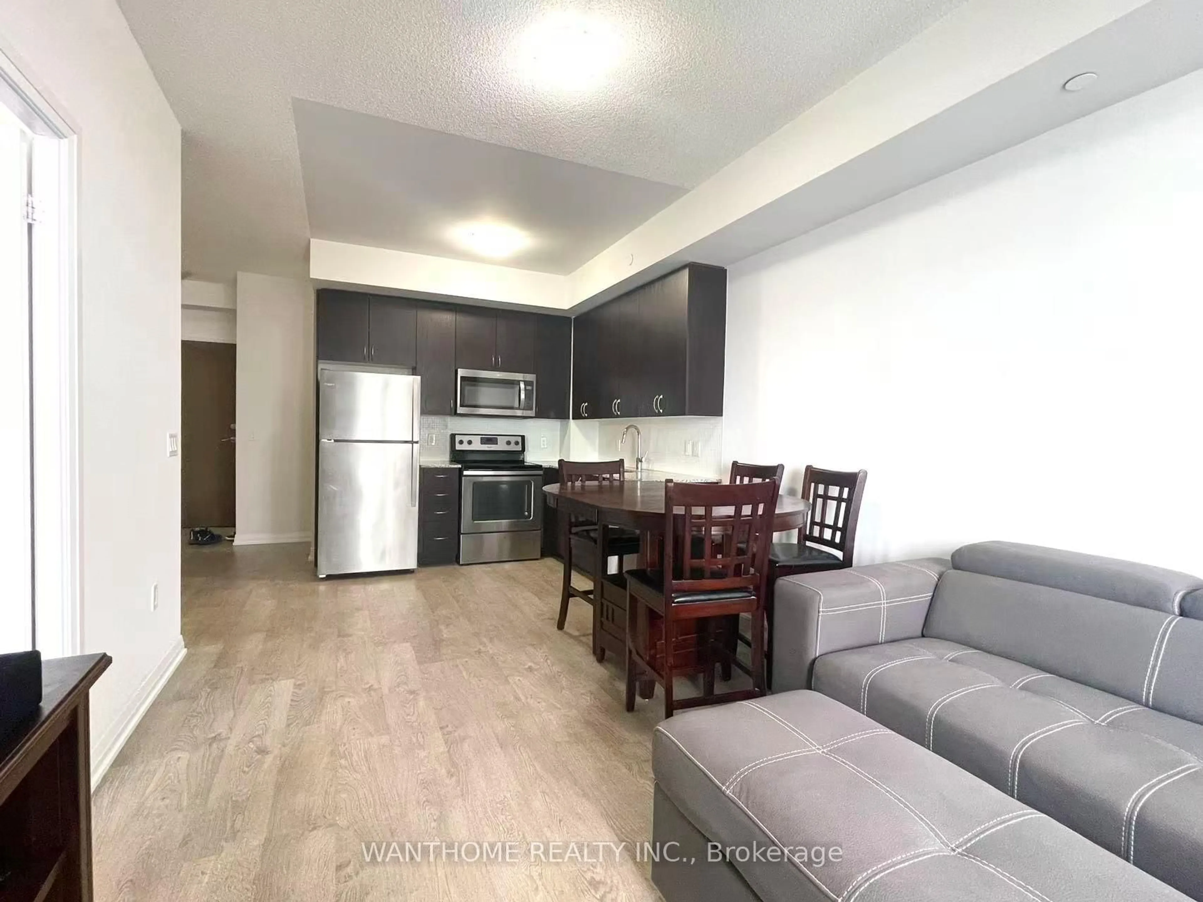 Living room with furniture, wood/laminate floor for 9560 Markham Rd #1205, Markham Ontario L6E 0T9