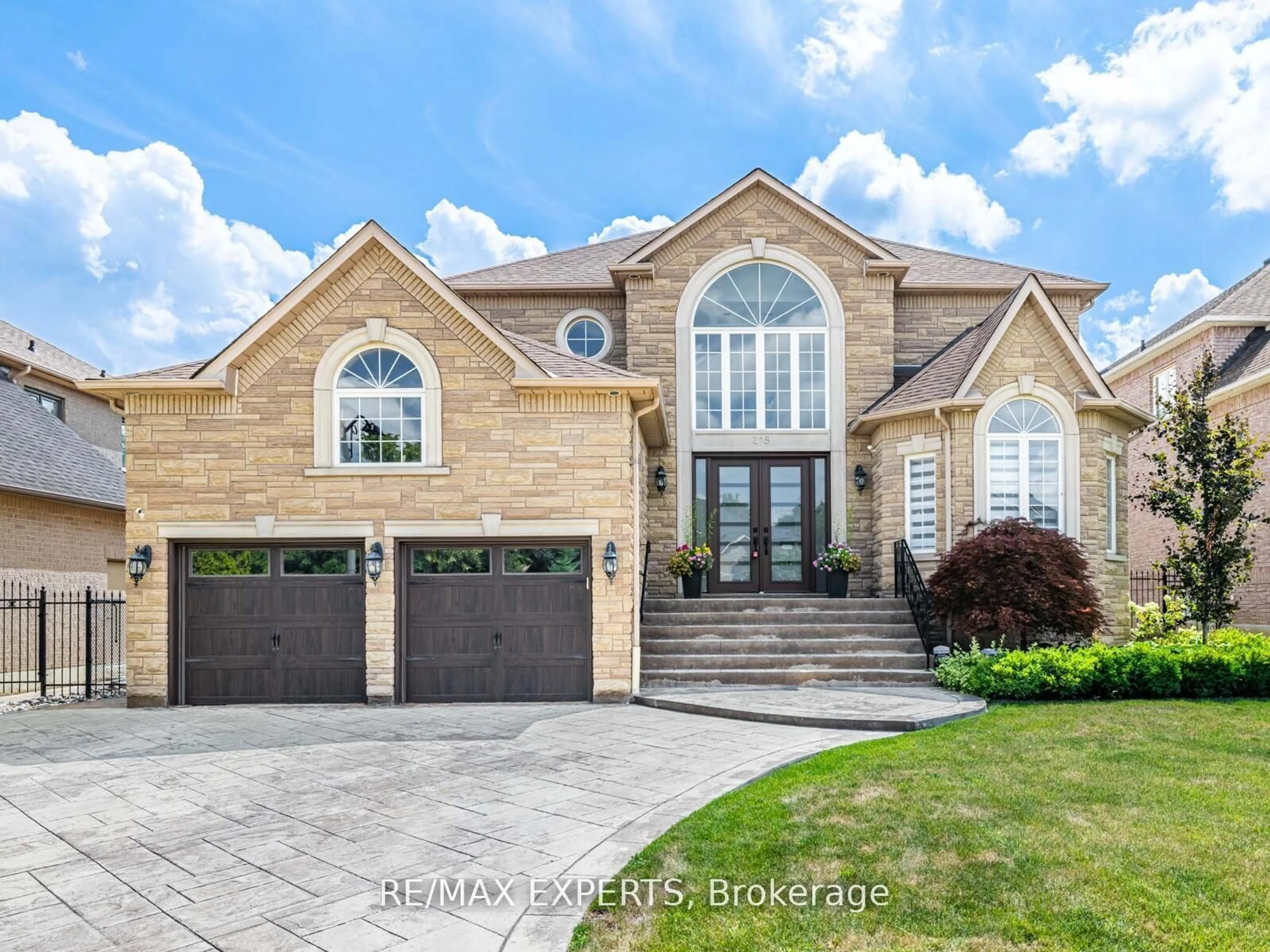 Home with brick exterior material, street for 215 Thomson Creek Blvd, Vaughan Ontario L4H 1H1