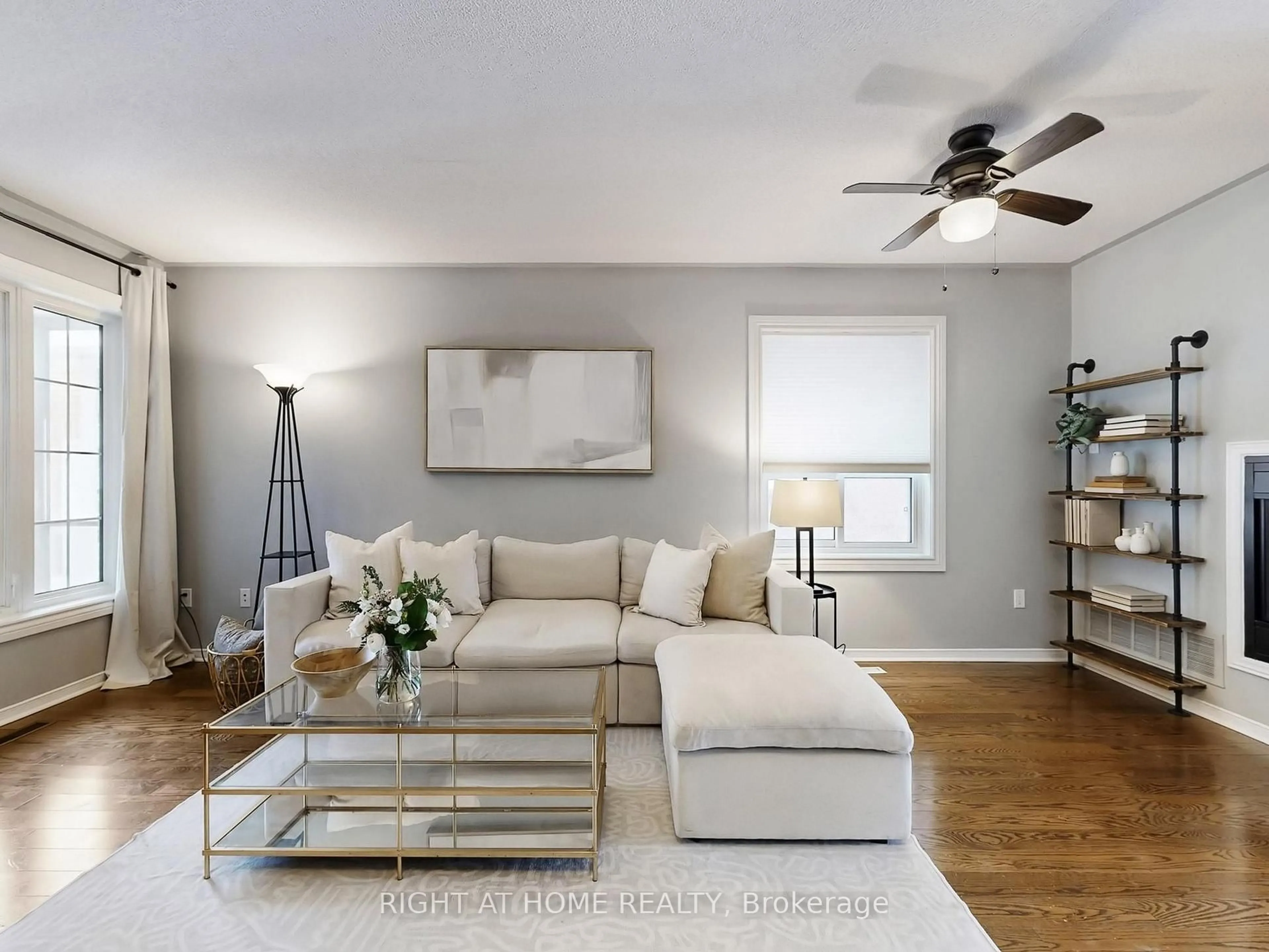 Living room with furniture, wood/laminate floor for 605 Willowick Dr, Newmarket Ontario L3X 2A9