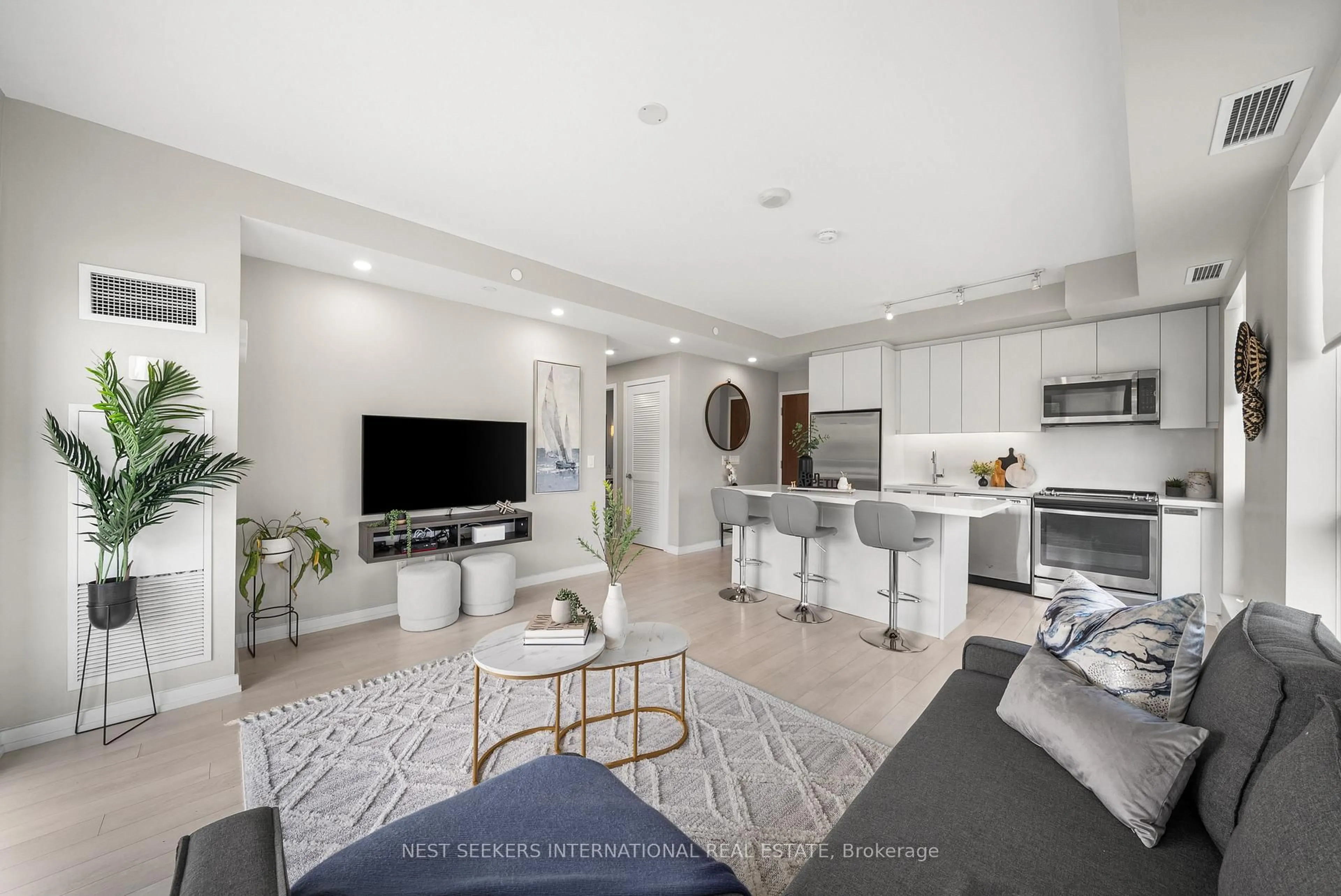 Open concept kitchen, ceramic/tile floor for 241 Sea Ray Ave #A213, Innisfil Ontario L9S 2P7